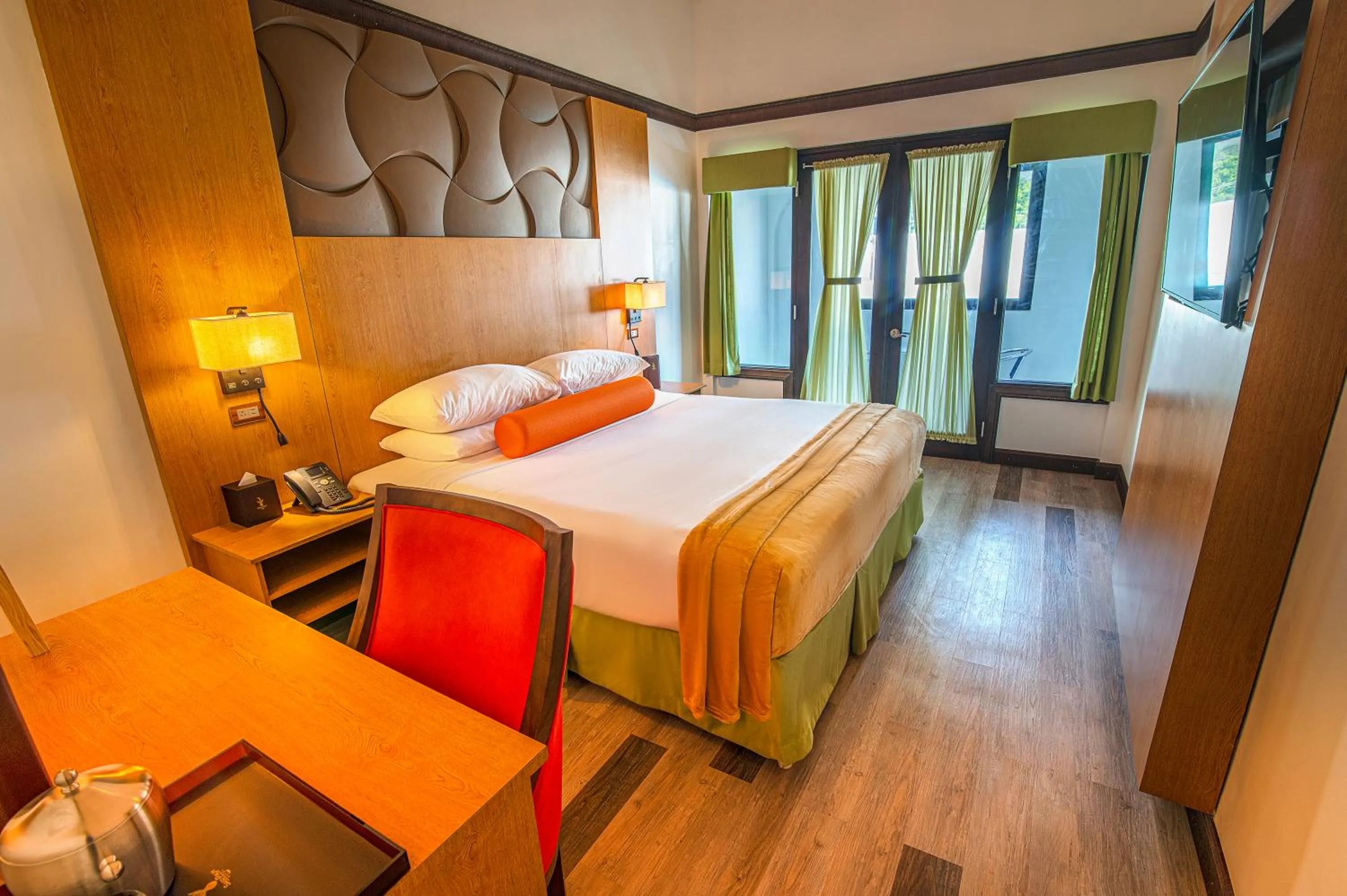 Bed in Sago Palm Hotel