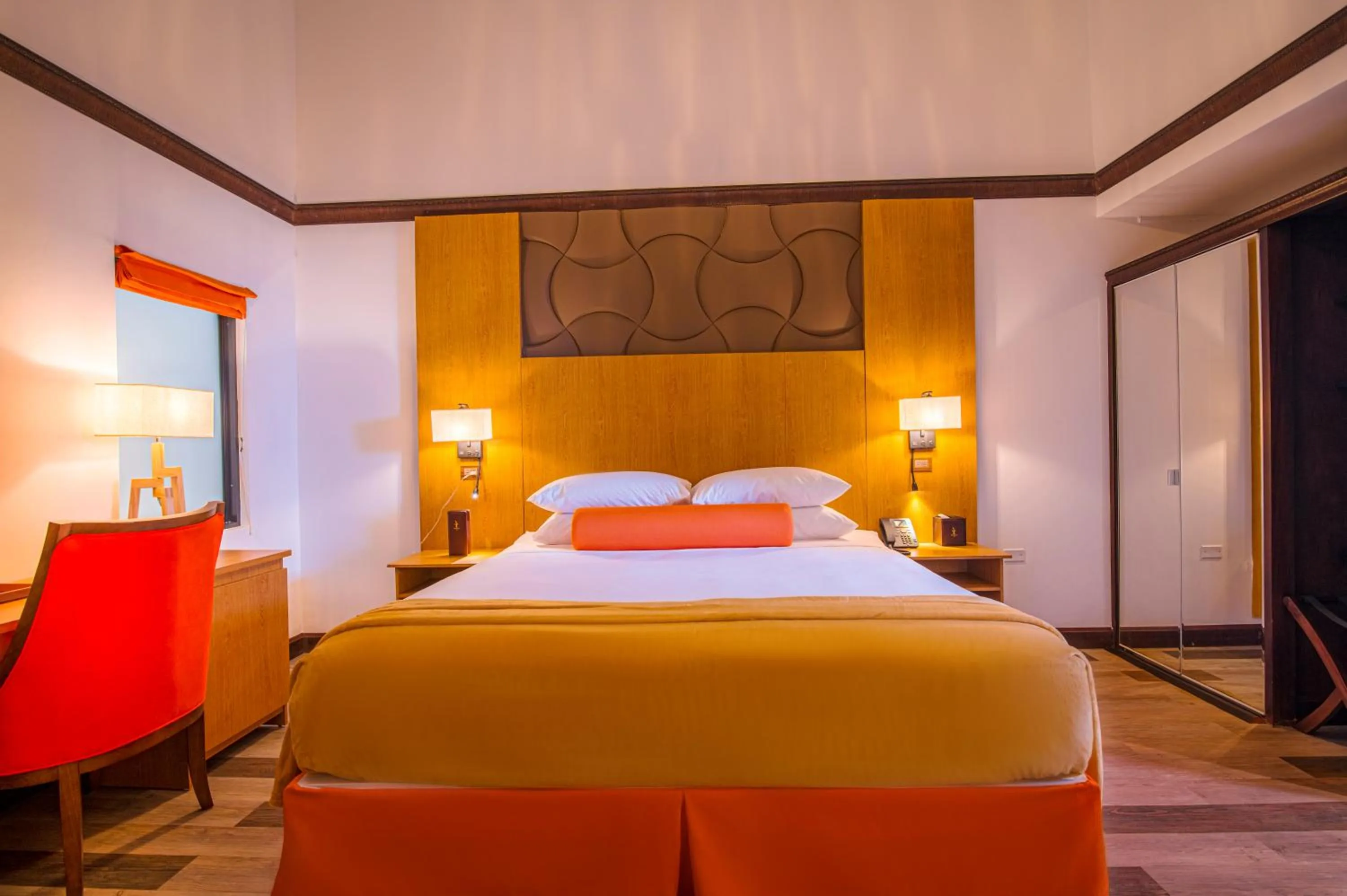 Bed in Sago Palm Hotel