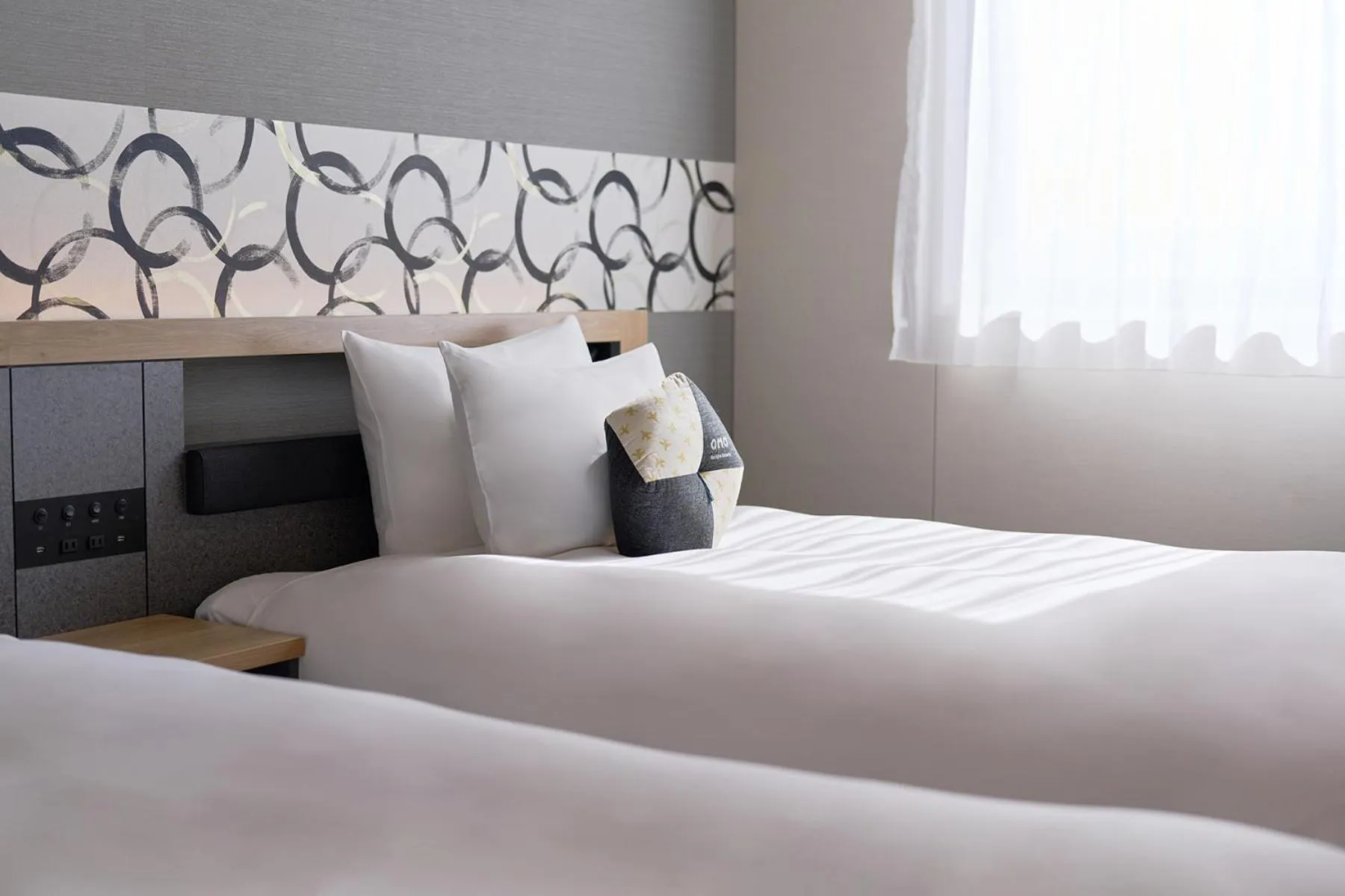 Bed in OMO Kansai Airport by Hoshino Resorts