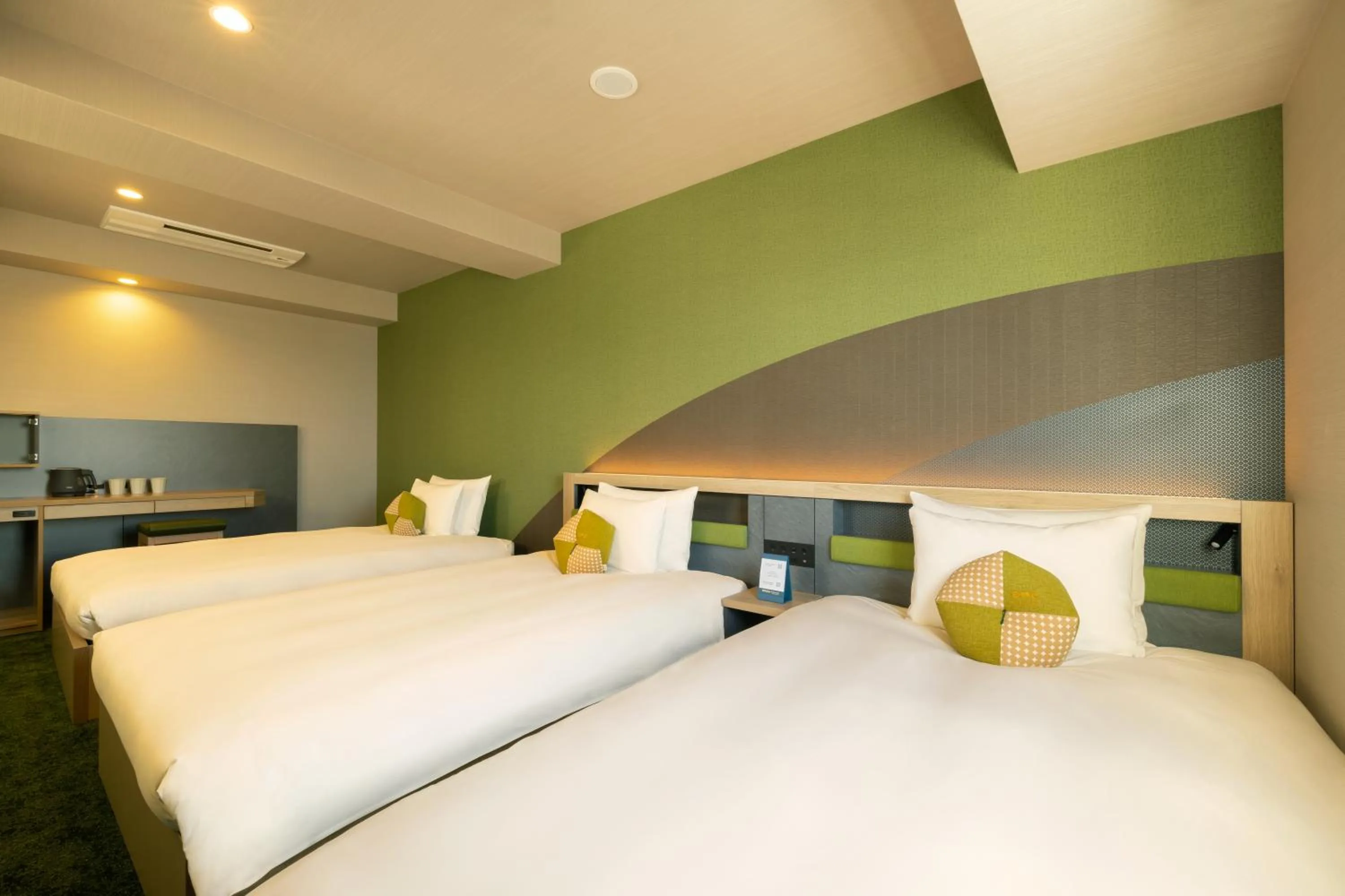 Bed in OMO Kansai Airport by Hoshino Resorts