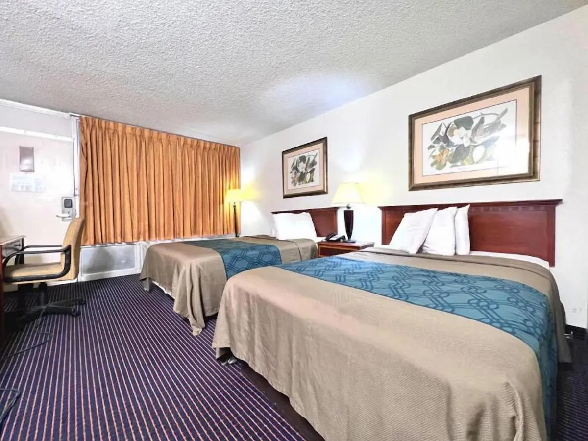 Bed in Heritage Inn & Suites by Capital O Baton Rouge I 10