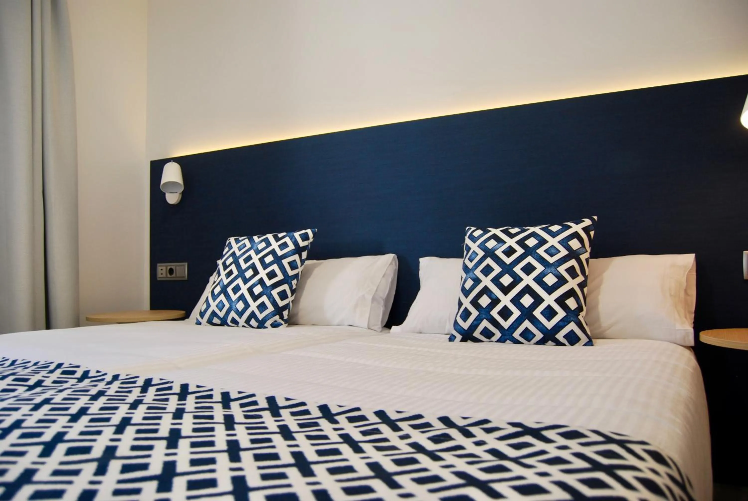 Bed in Broncemar Beach Suites