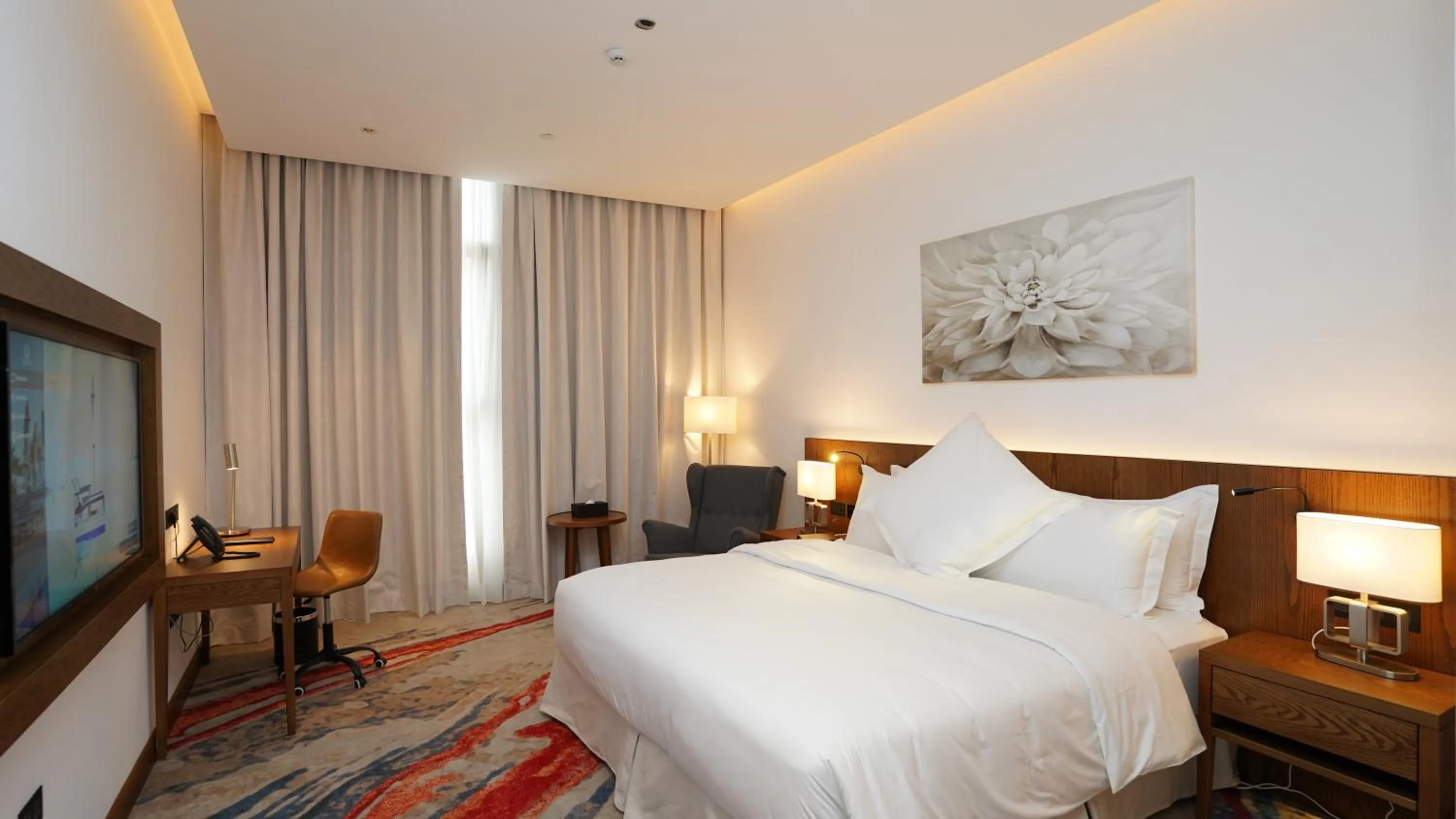 Bed in Jasmine Garden Hotel