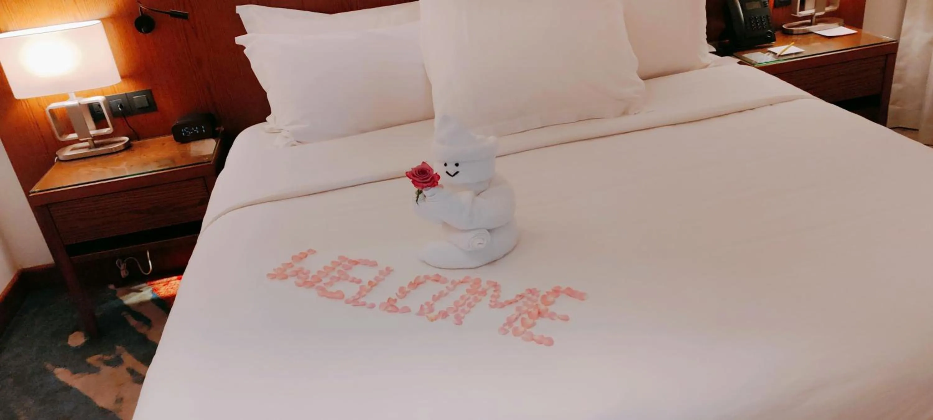 Bed in Jasmine Garden Hotel