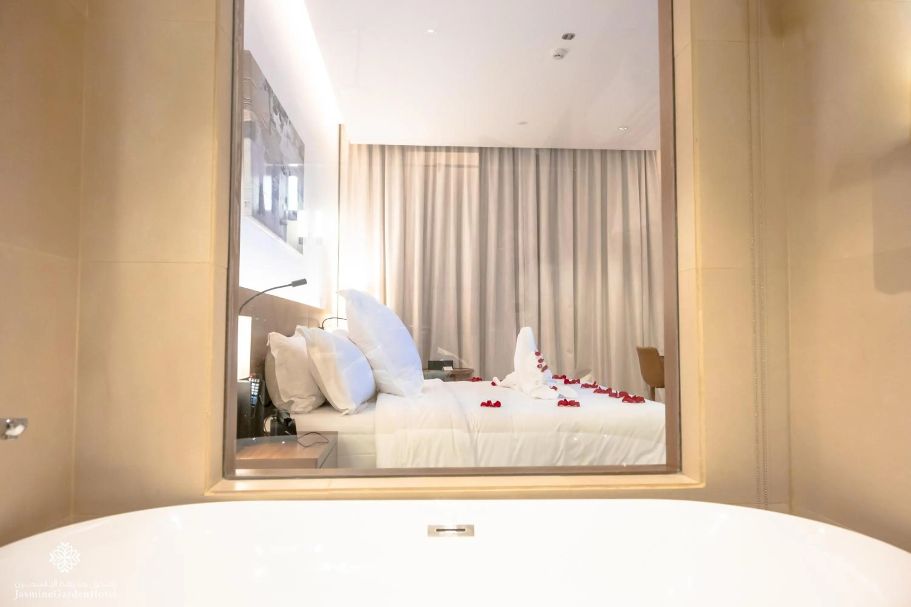 Bed in Jasmine Garden Hotel