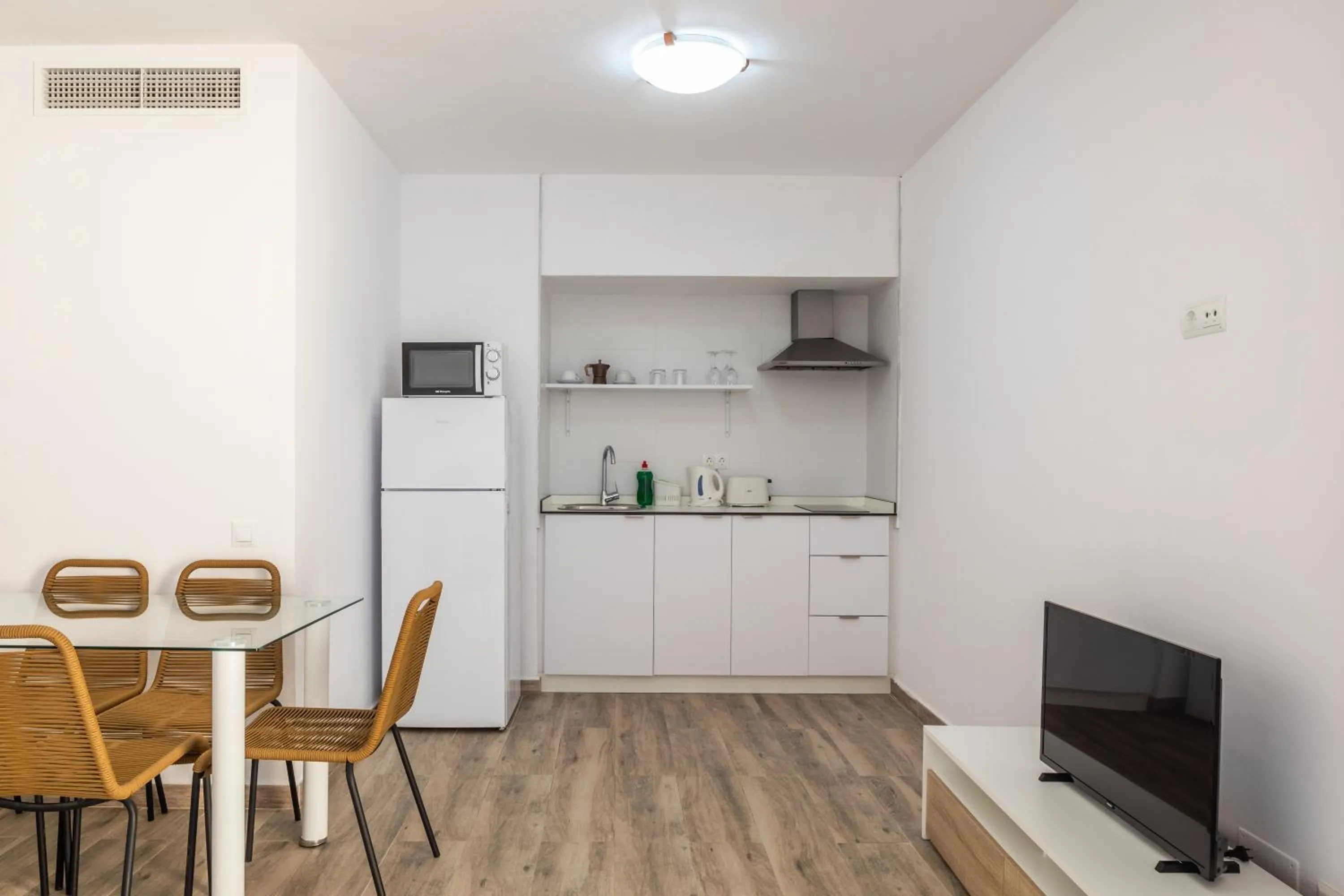 Kitchen or kitchenette in Aparthotel Puerto Cala Vadella