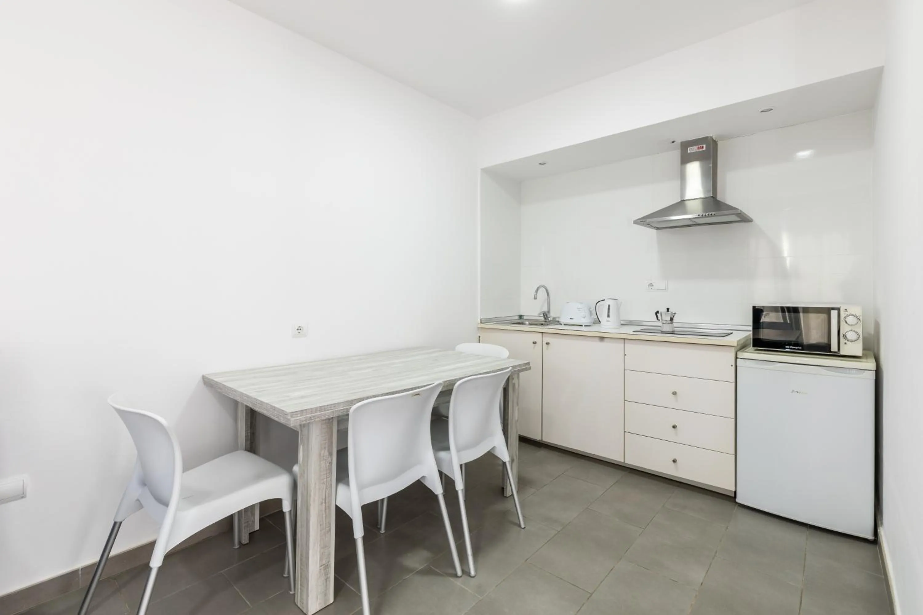 Kitchen or kitchenette in Aparthotel Puerto Cala Vadella