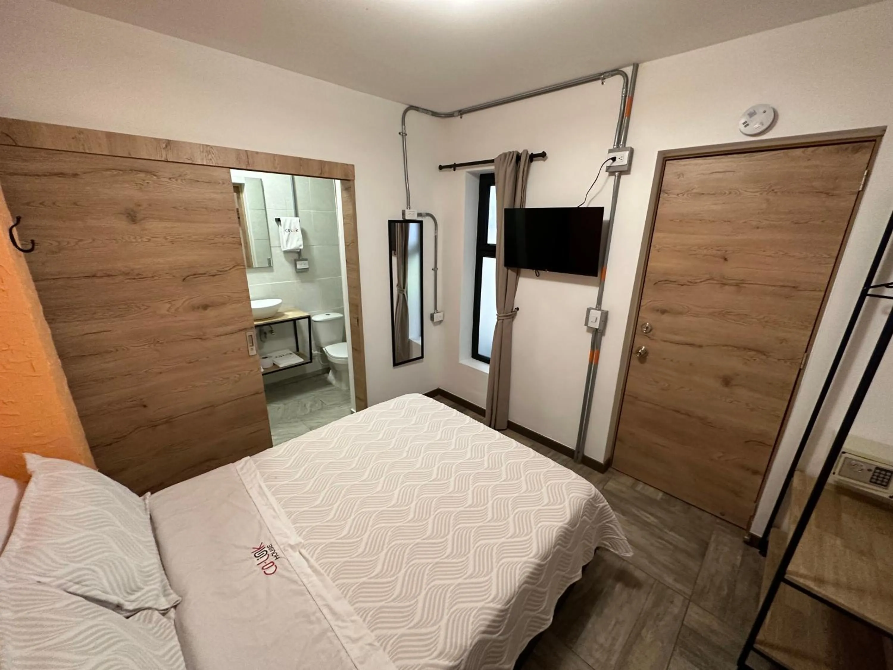 Bed in CoLinkHouse Hotel