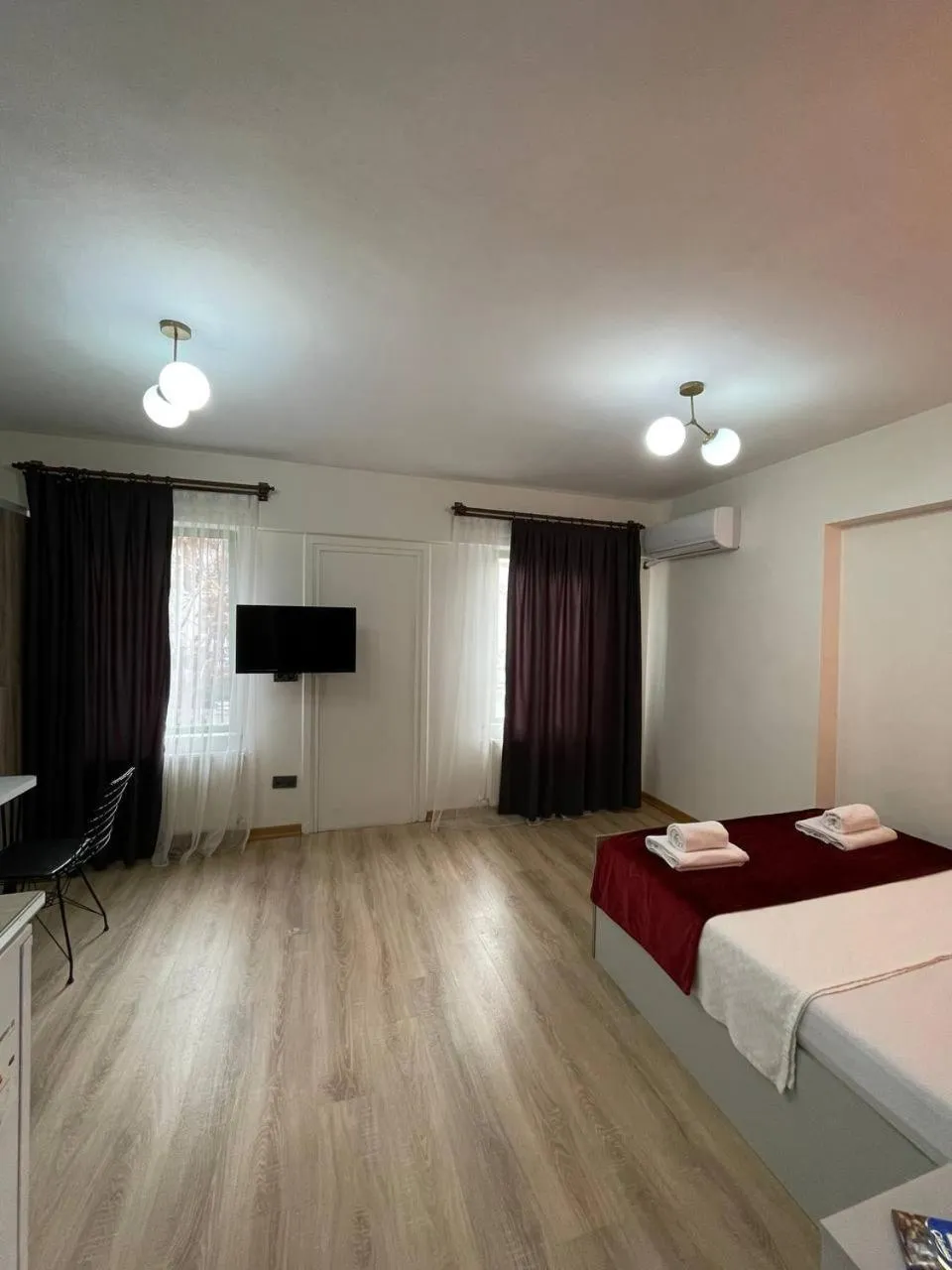 Communal lounge/ TV room, Bed in PANORAMA CITY SUITE