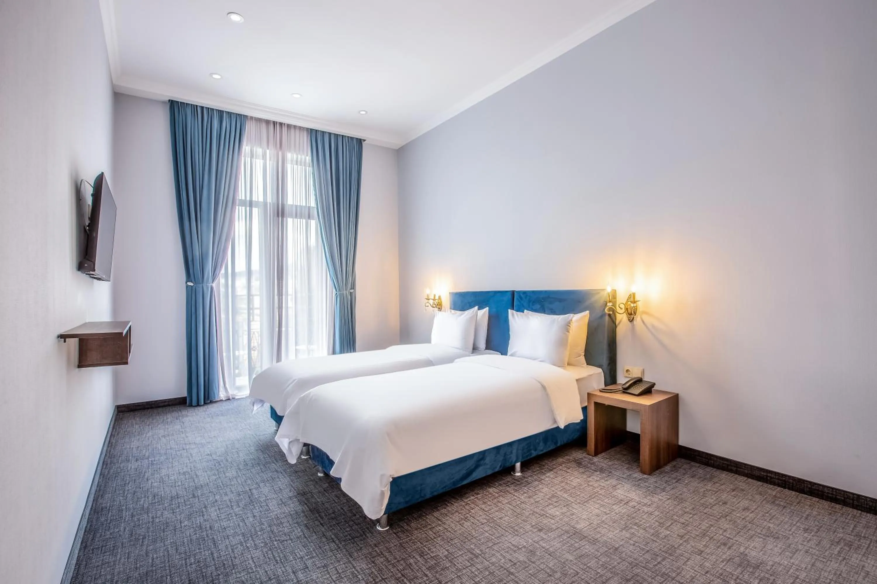 Bed in Alma Boutique Hotel