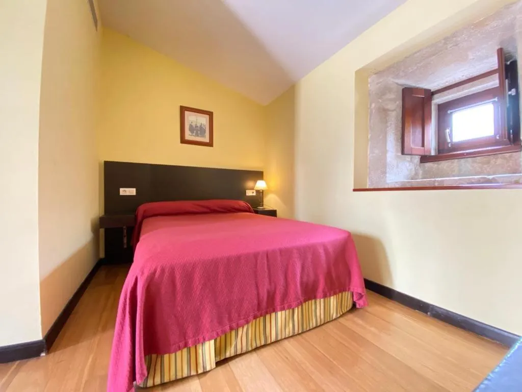 Bed in Hotel Pazo de Lestrove by Pousadas de Compostela