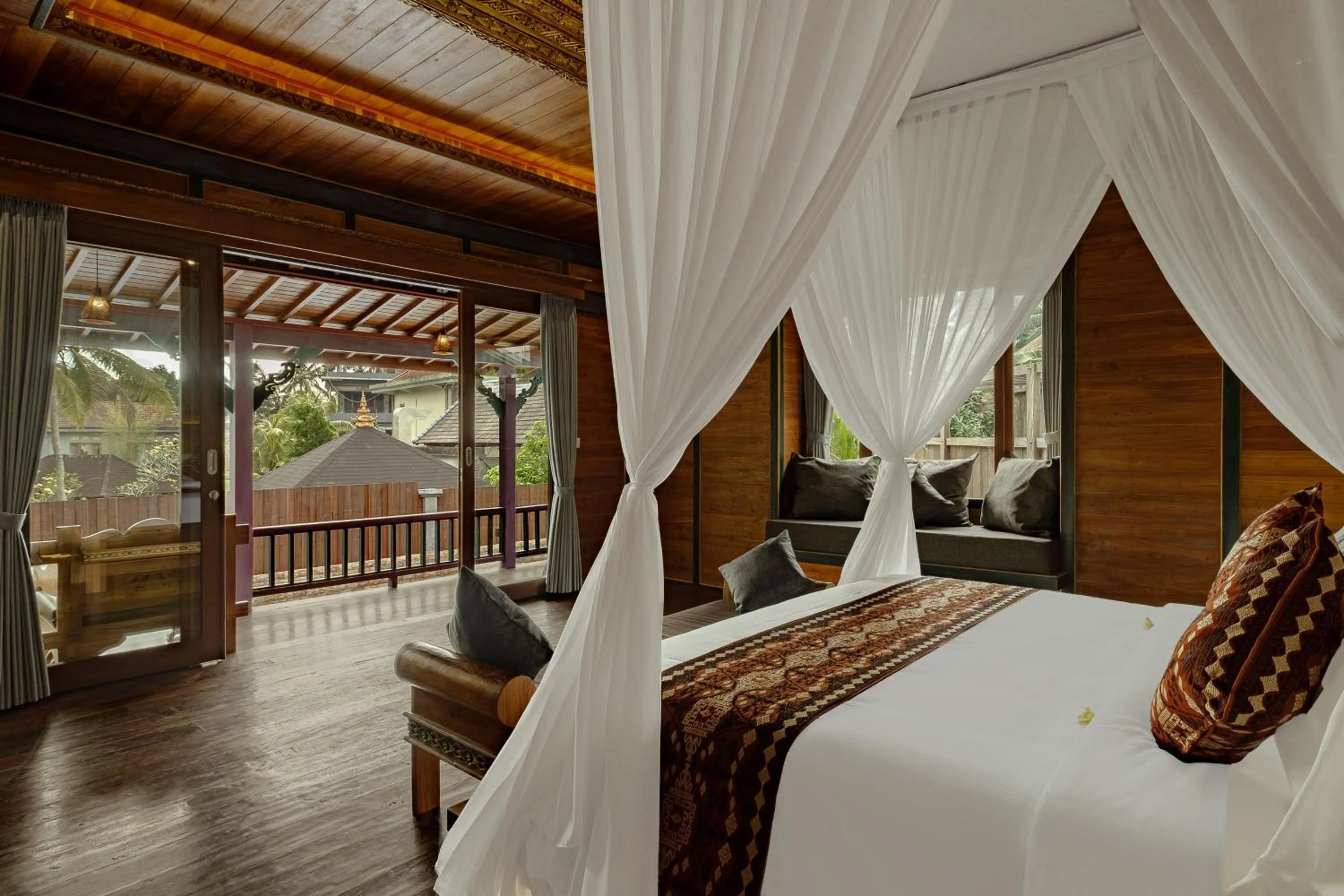 Bed in Gynandha Ubud Cottage