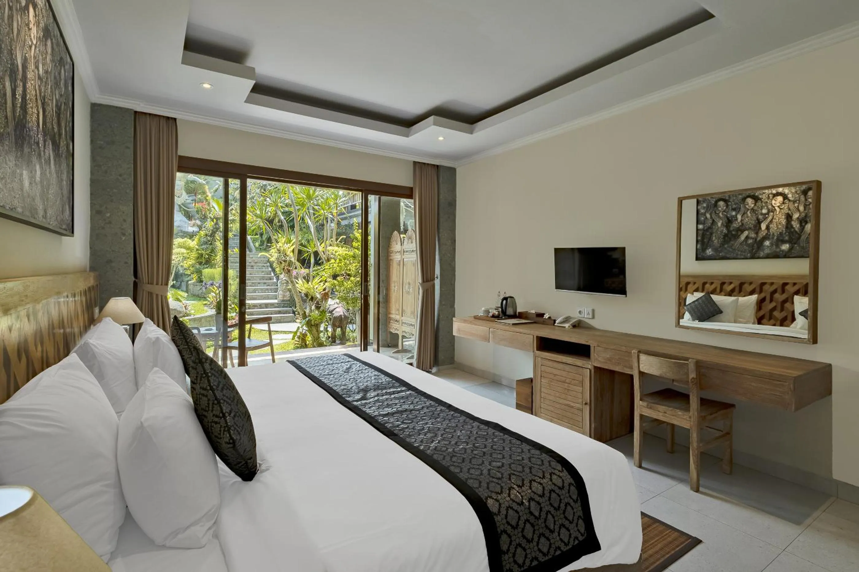 Bed in Gynandha Ubud Cottage