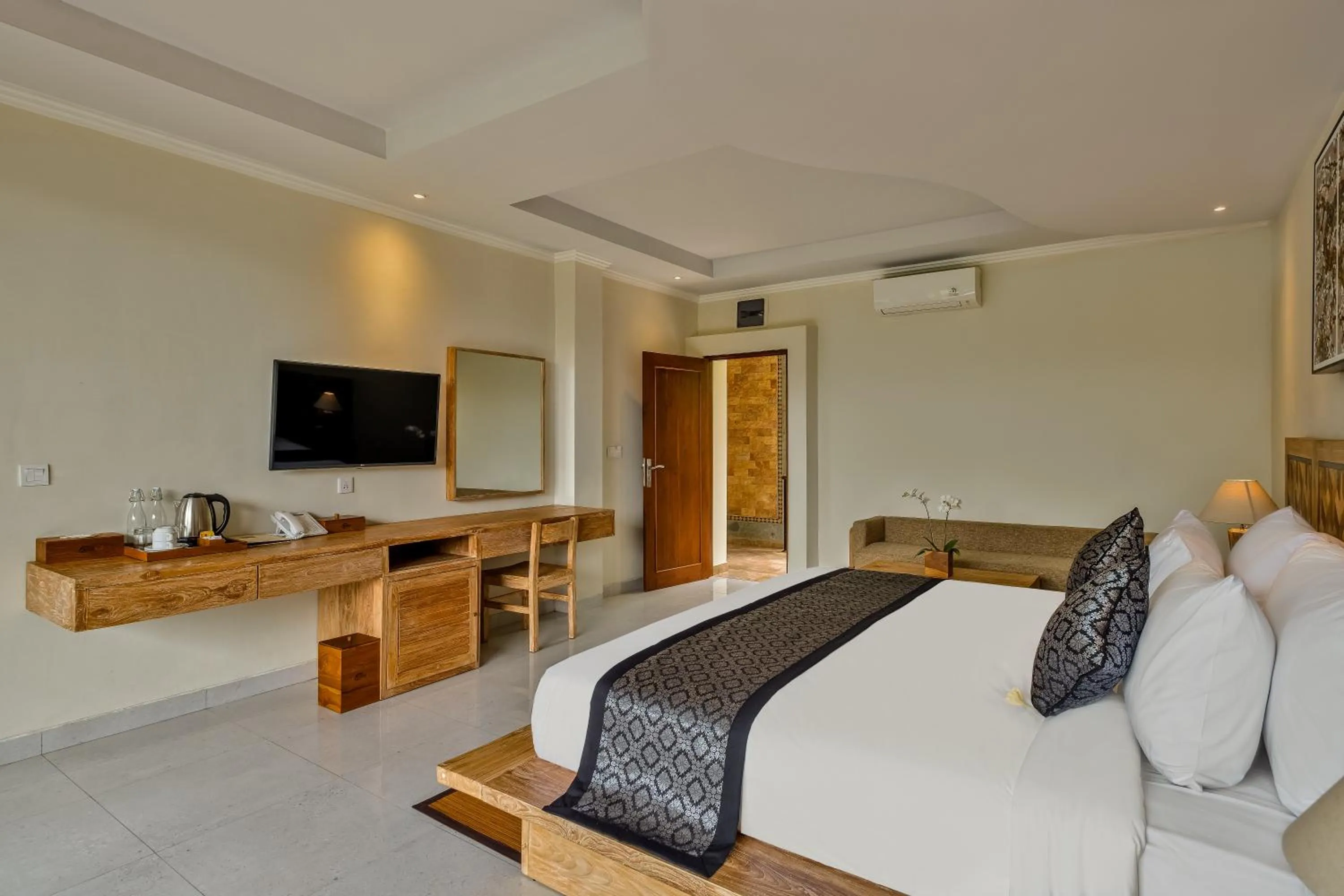 Bed in Gynandha Ubud Cottage