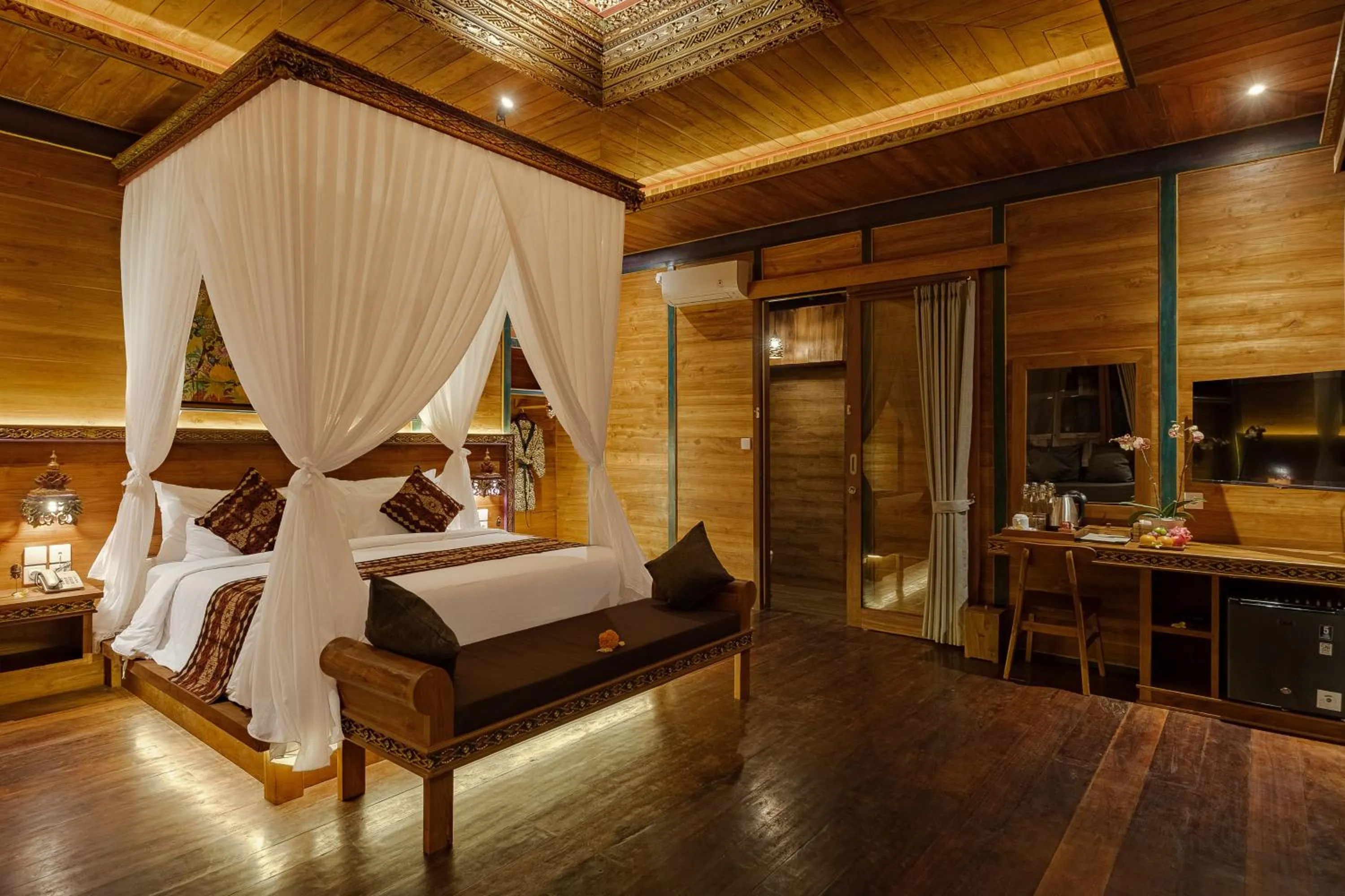 Bed in Gynandha Ubud Cottage