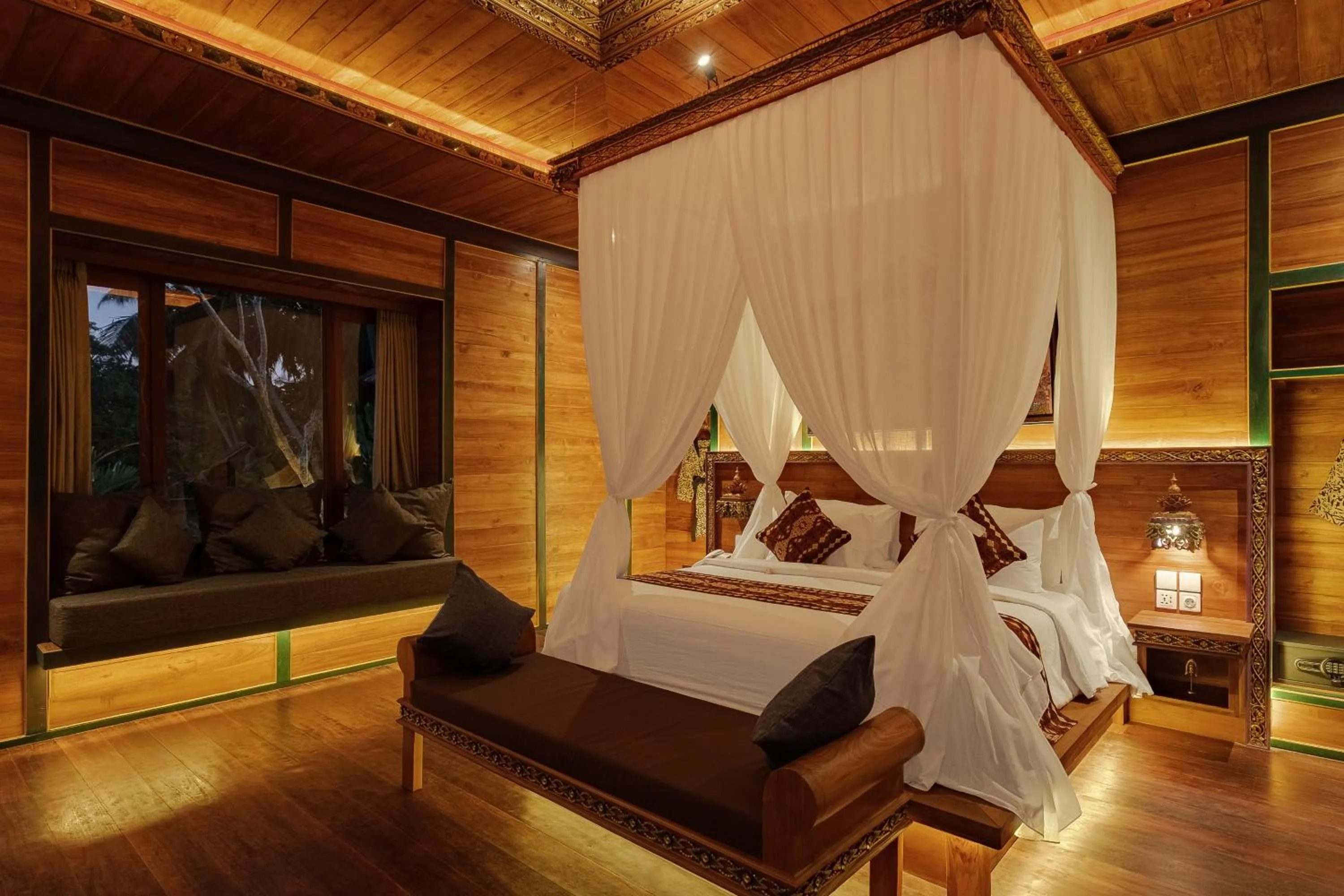 Bed in Gynandha Ubud Cottage