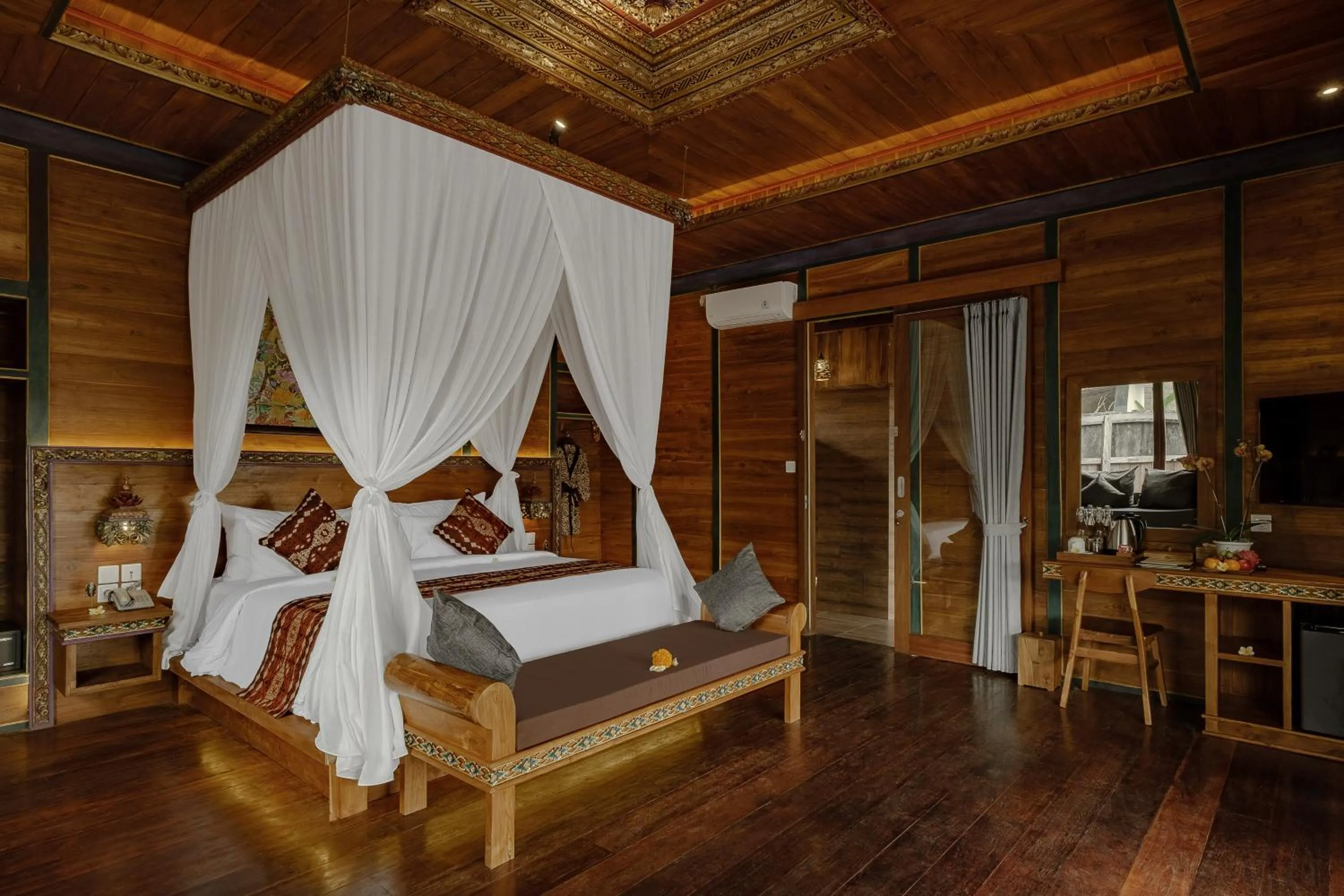 Bed in Gynandha Ubud Cottage