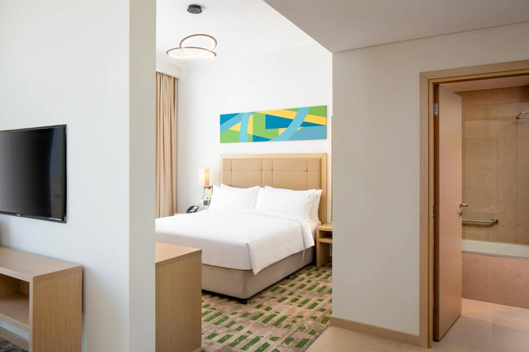 Photo of the whole room, Bed in Holiday Inn & Suites - Dubai Science Park by IHG