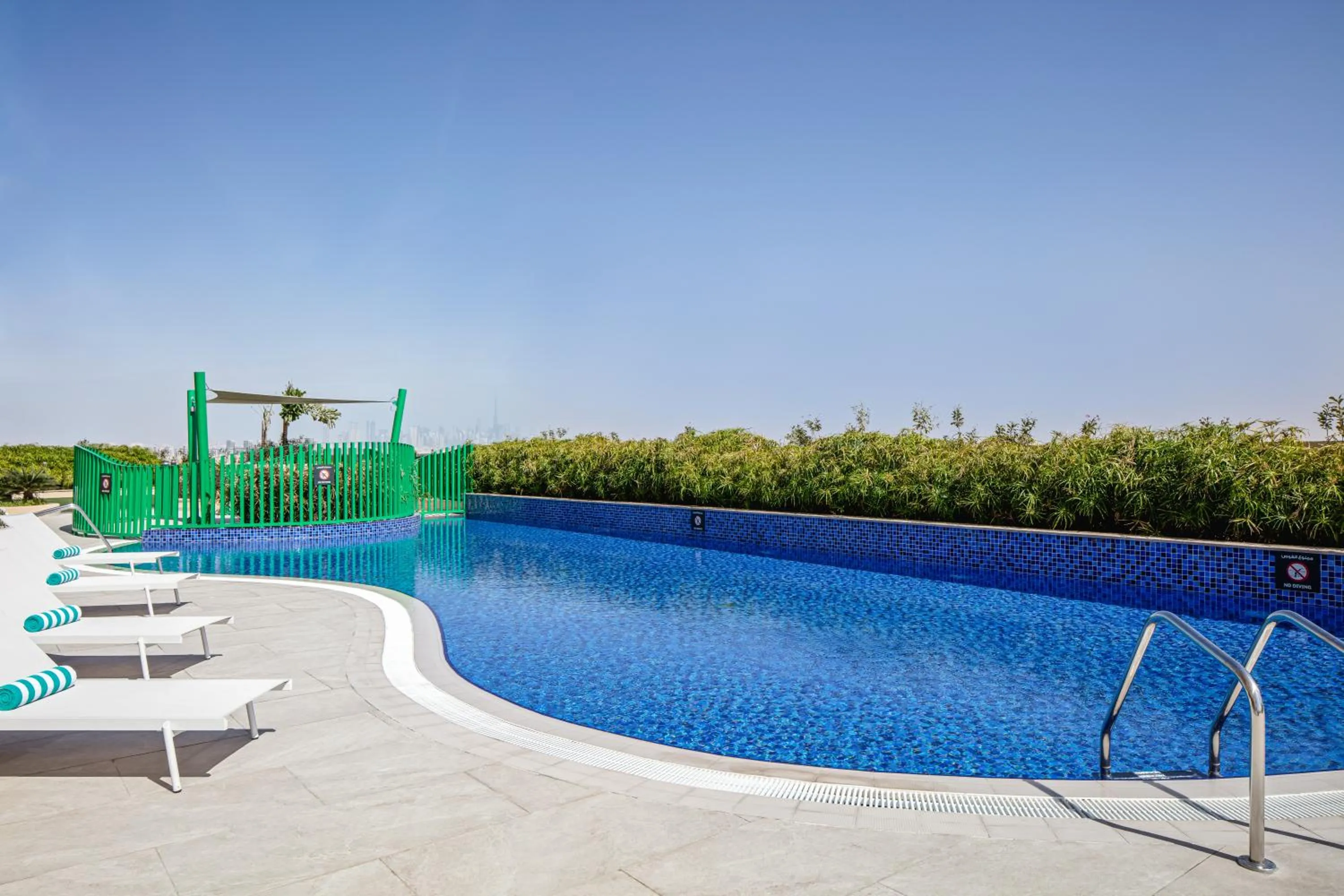 Swimming pool in Holiday Inn & Suites - Dubai Science Park by IHG