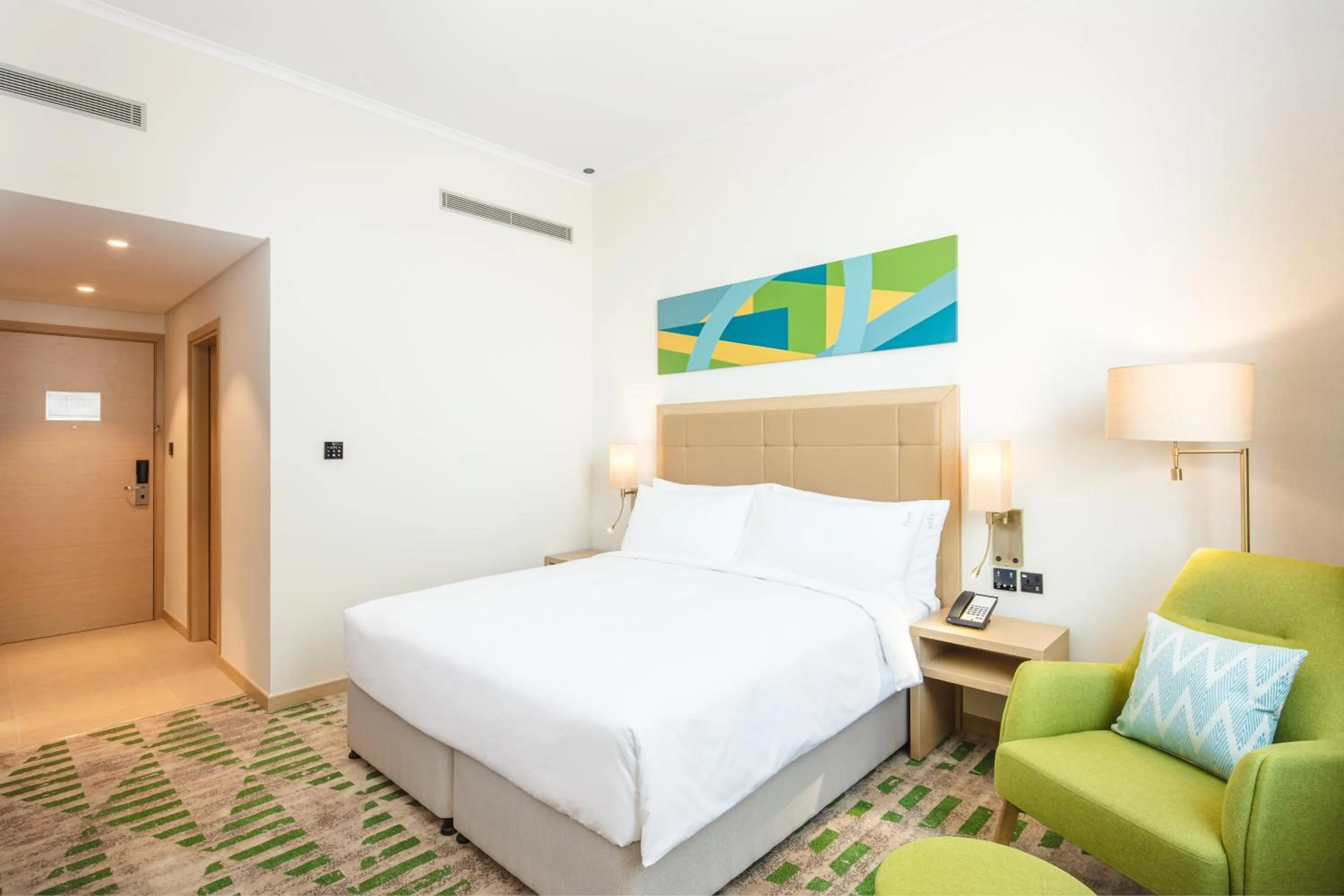 Bedroom, Bed in Holiday Inn & Suites - Dubai Science Park by IHG
