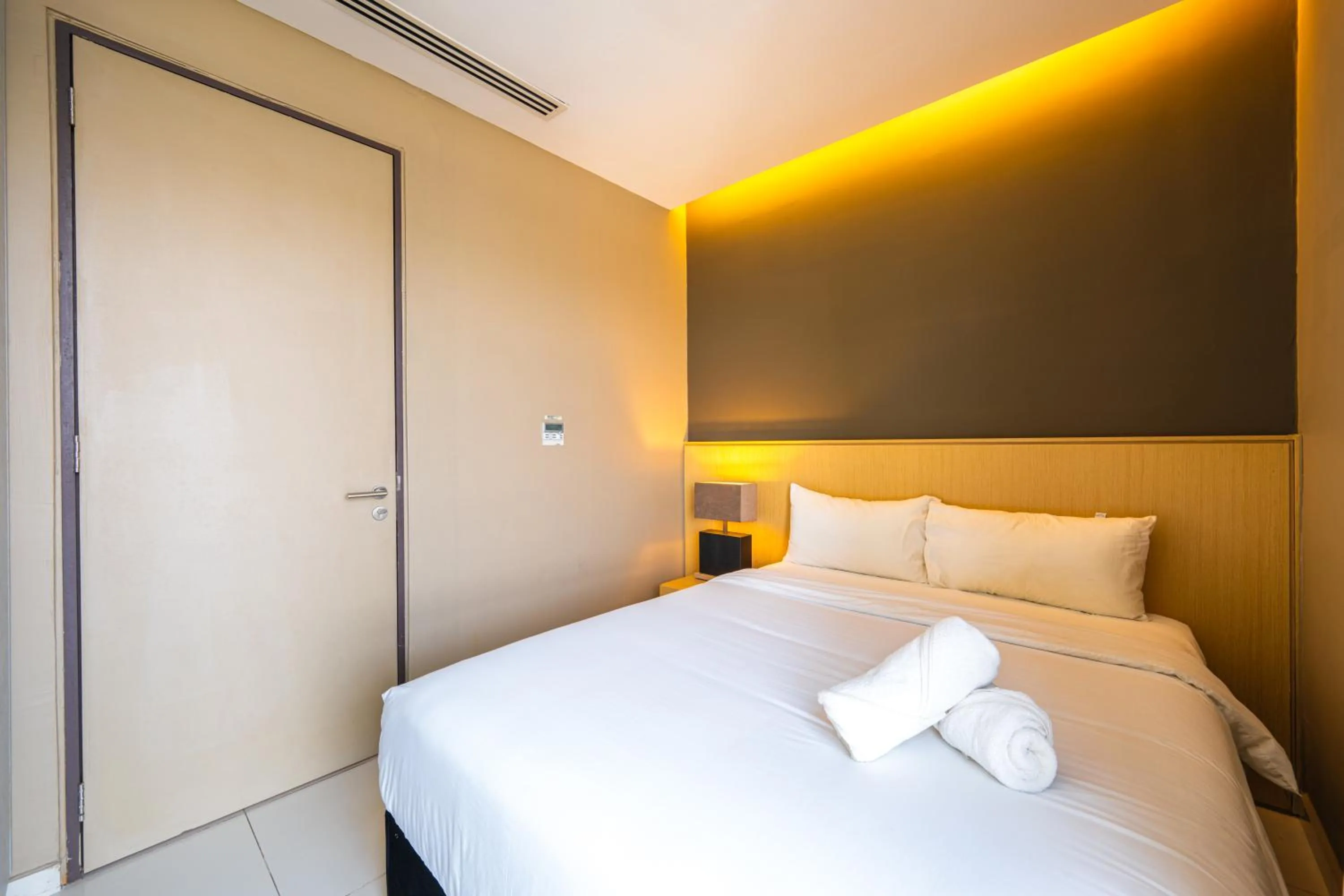 Bed in Greystone 99 Suites