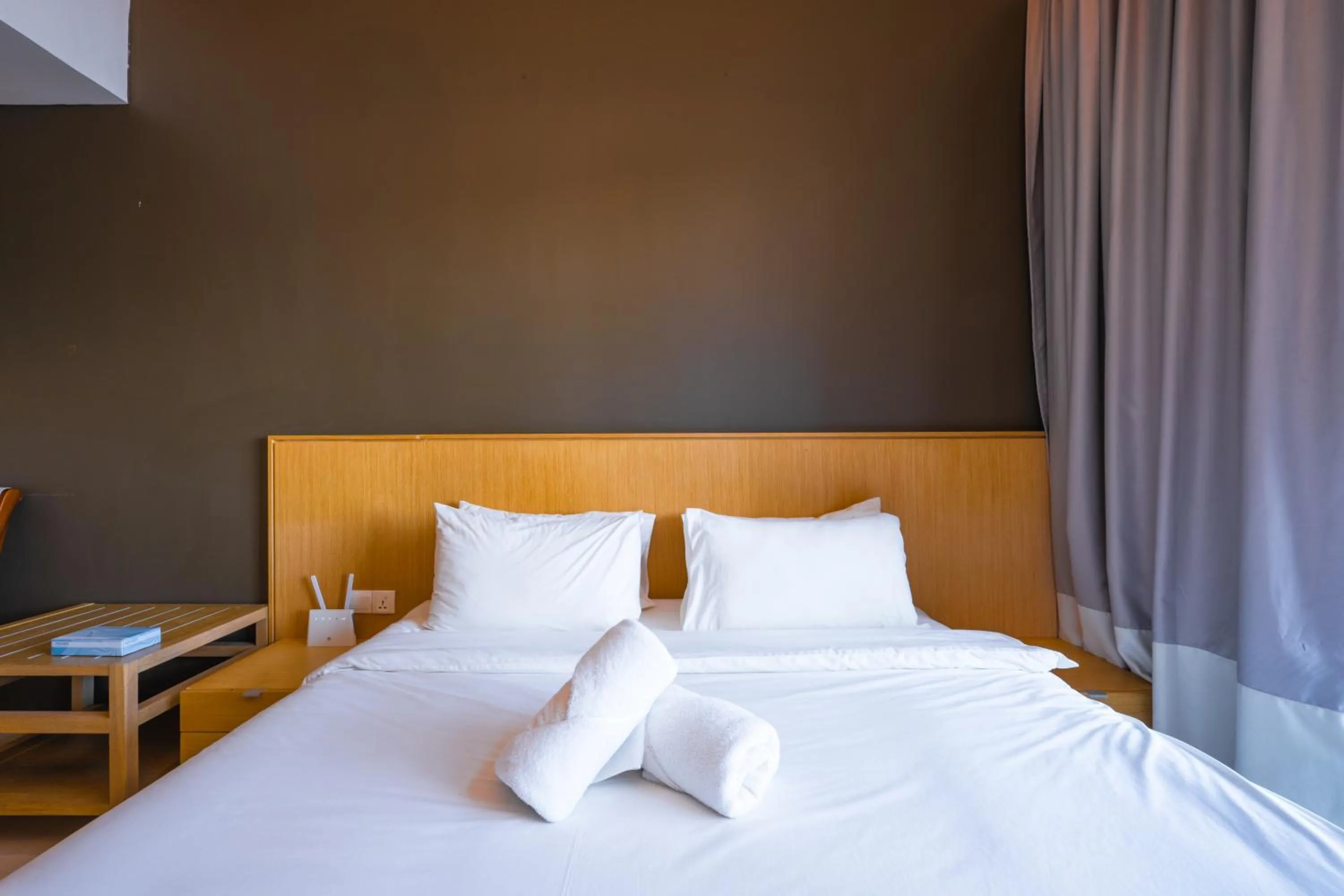 Bed in Greystone 99 Suites