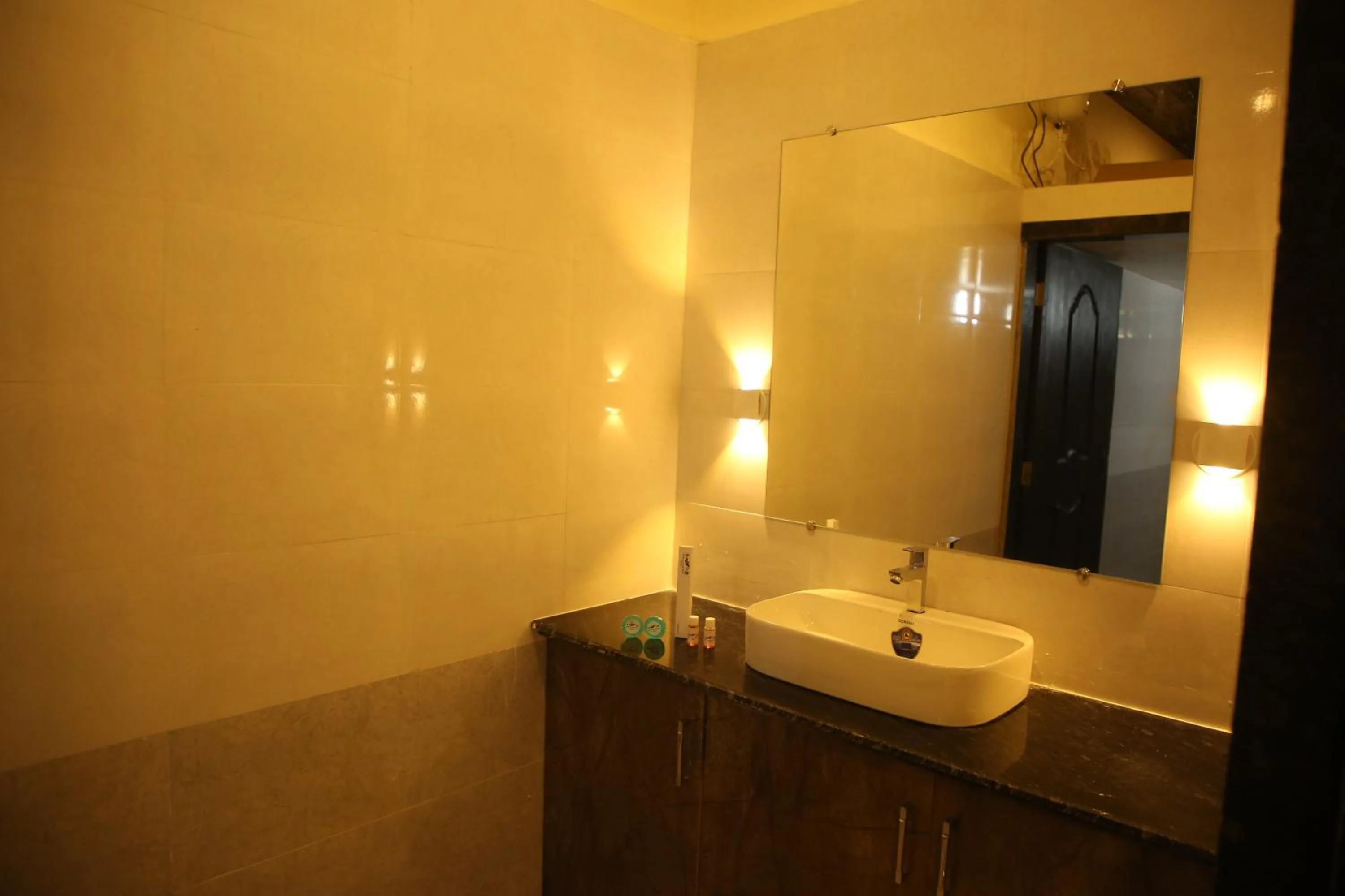 Bathroom in Ashoka Lawns and Resort