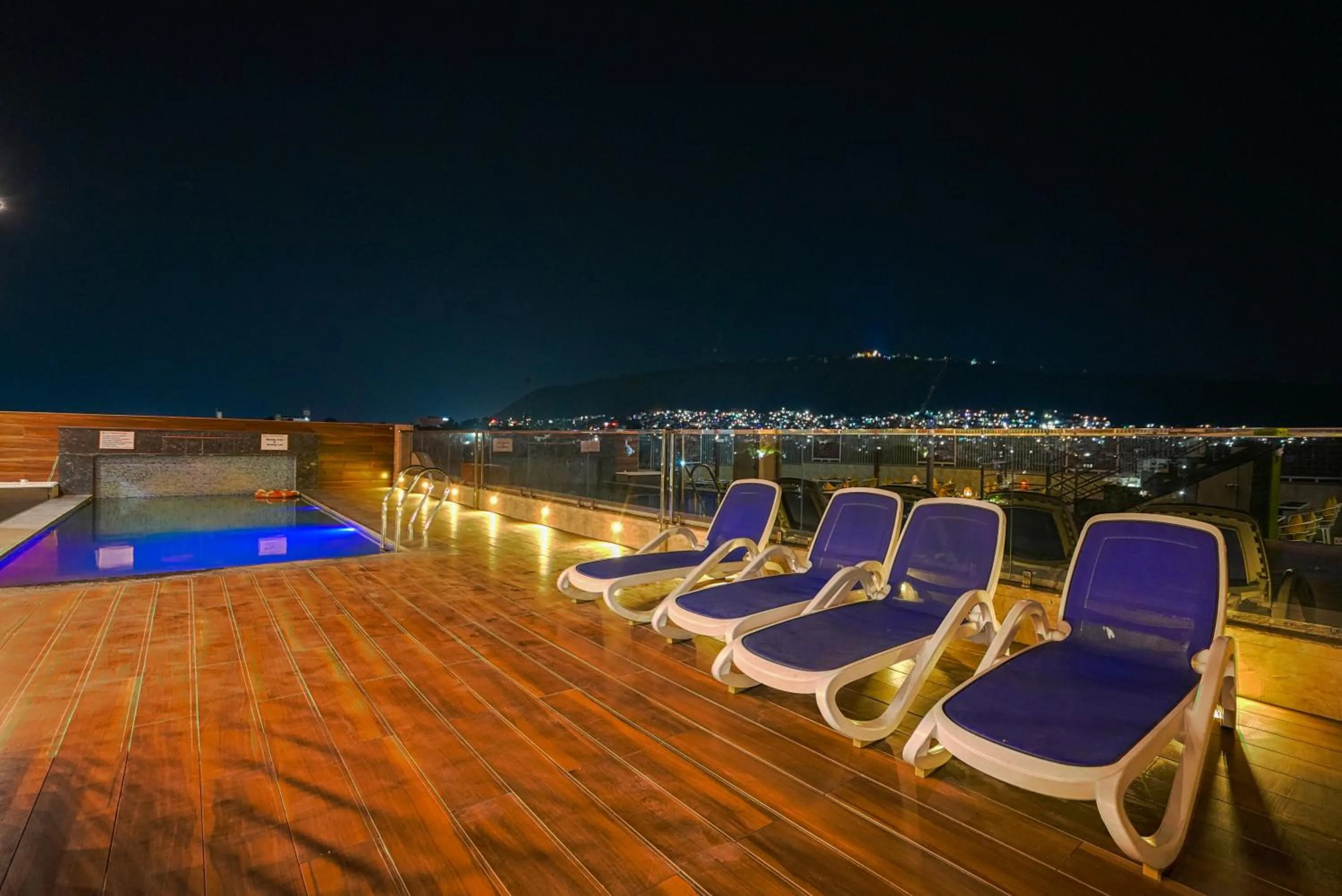 Swimming pool in Pax Hotel Grand Blue 3 min walk from Udaipur city Railway Station