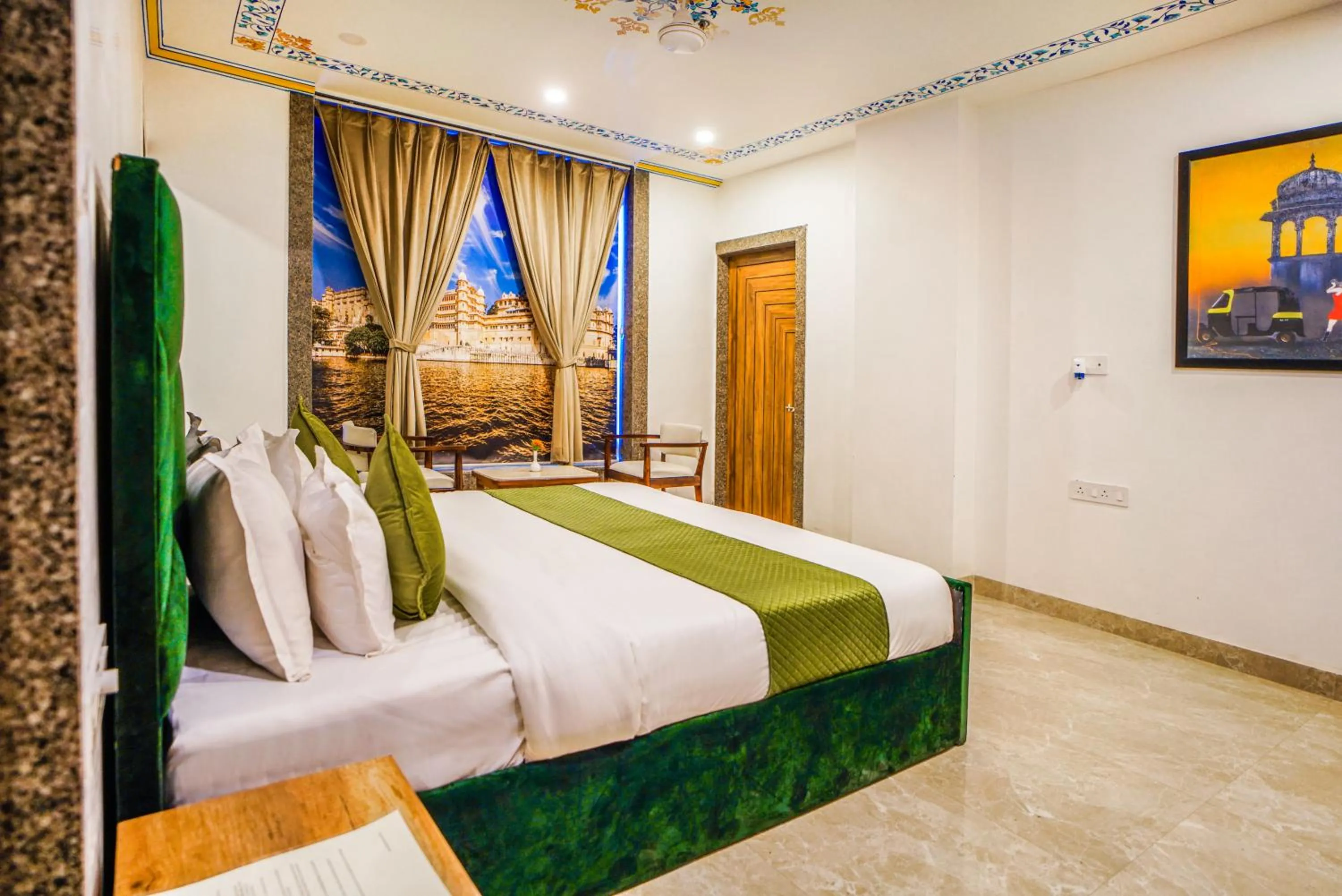 Living room, Bed in Pax Hotel Grand Blue 3 min walk from Udaipur city Railway Station