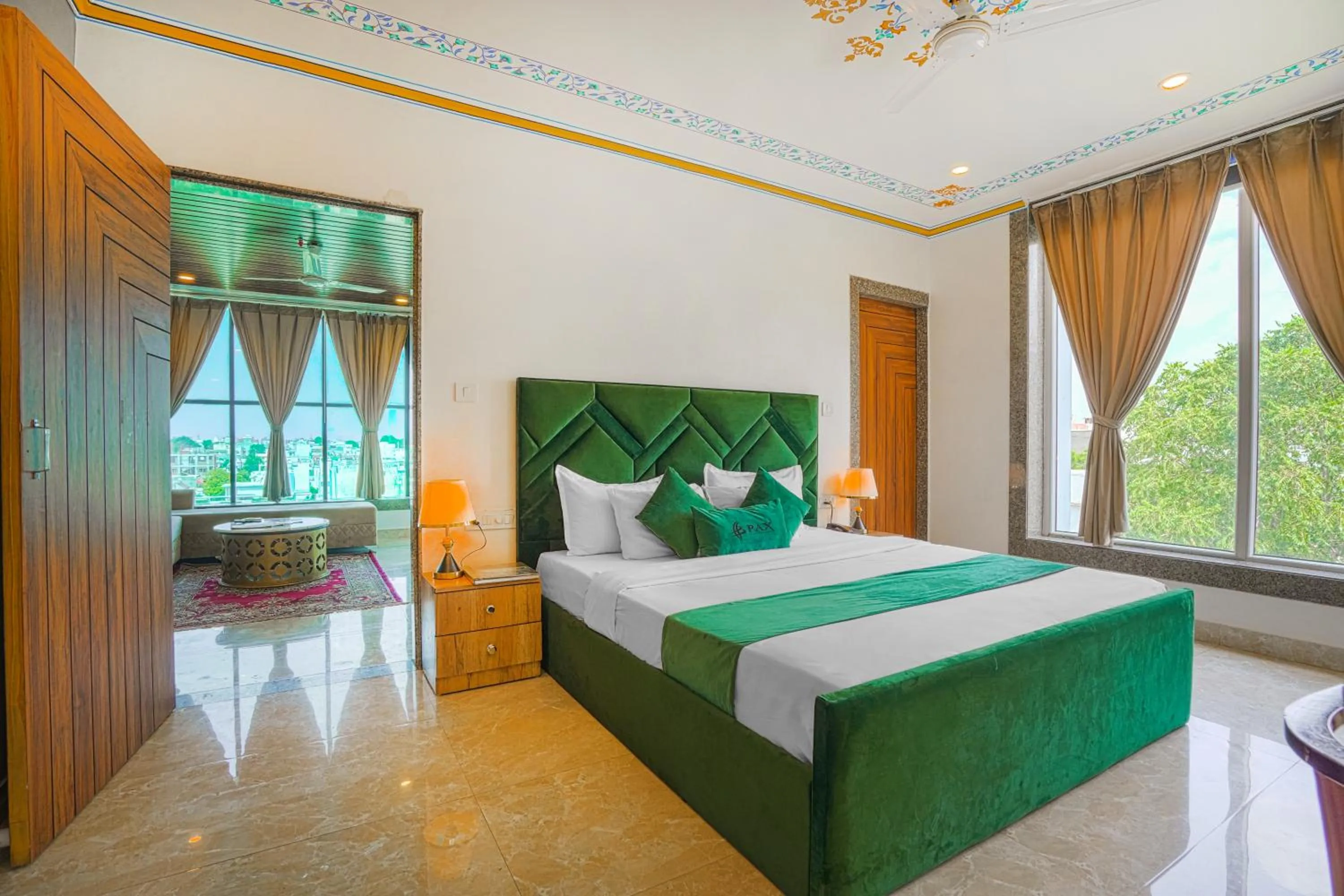 Photo of the whole room, Bed in Pax Hotel Grand Blue 3 min walk from Udaipur city Railway Station