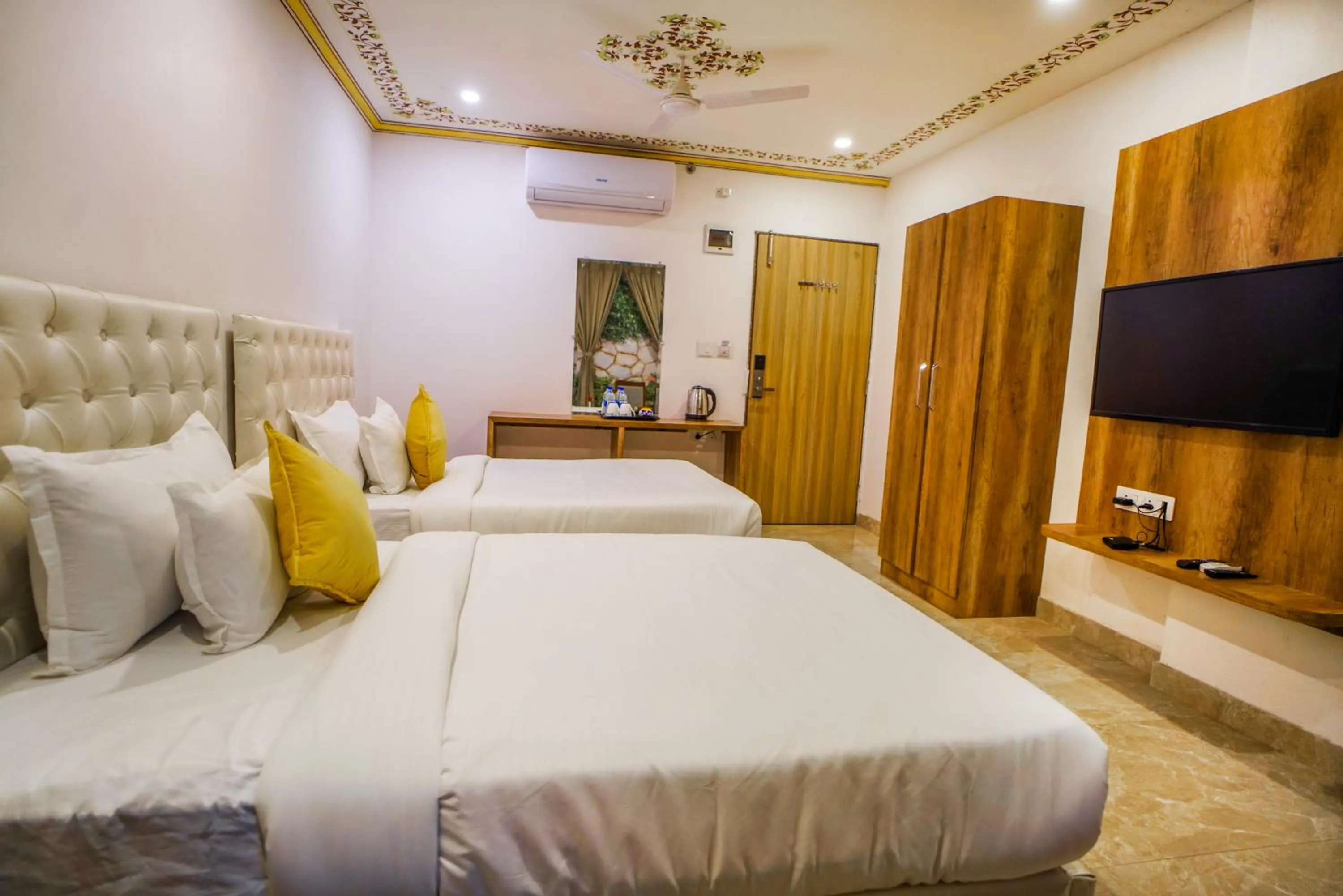 Bedroom, Bed in Pax Hotel Grand Blue 3 min walk from Udaipur city Railway Station