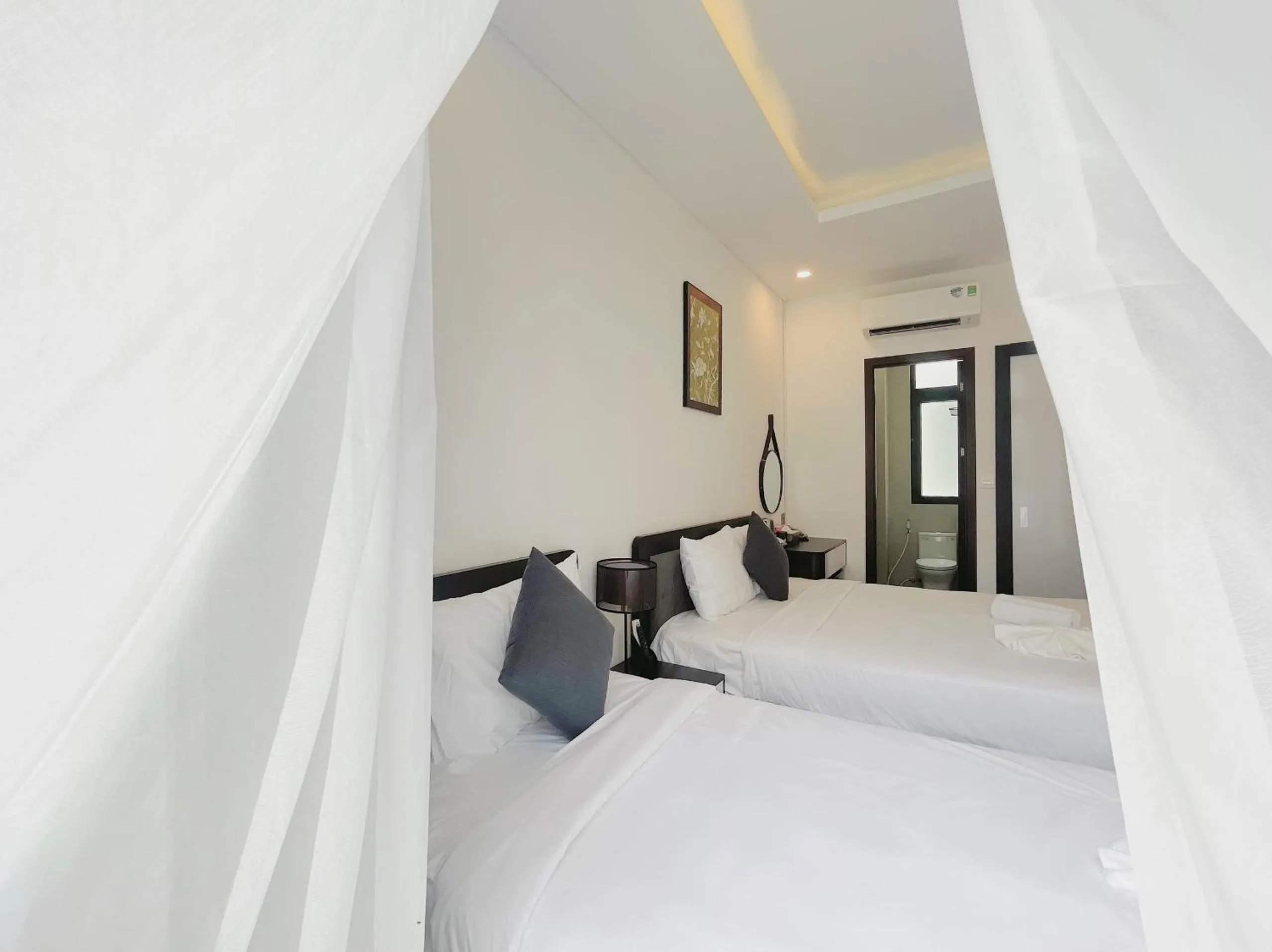 Bed in Le Palmier Phu Quoc Hotel - Free Shuttle To Grand World