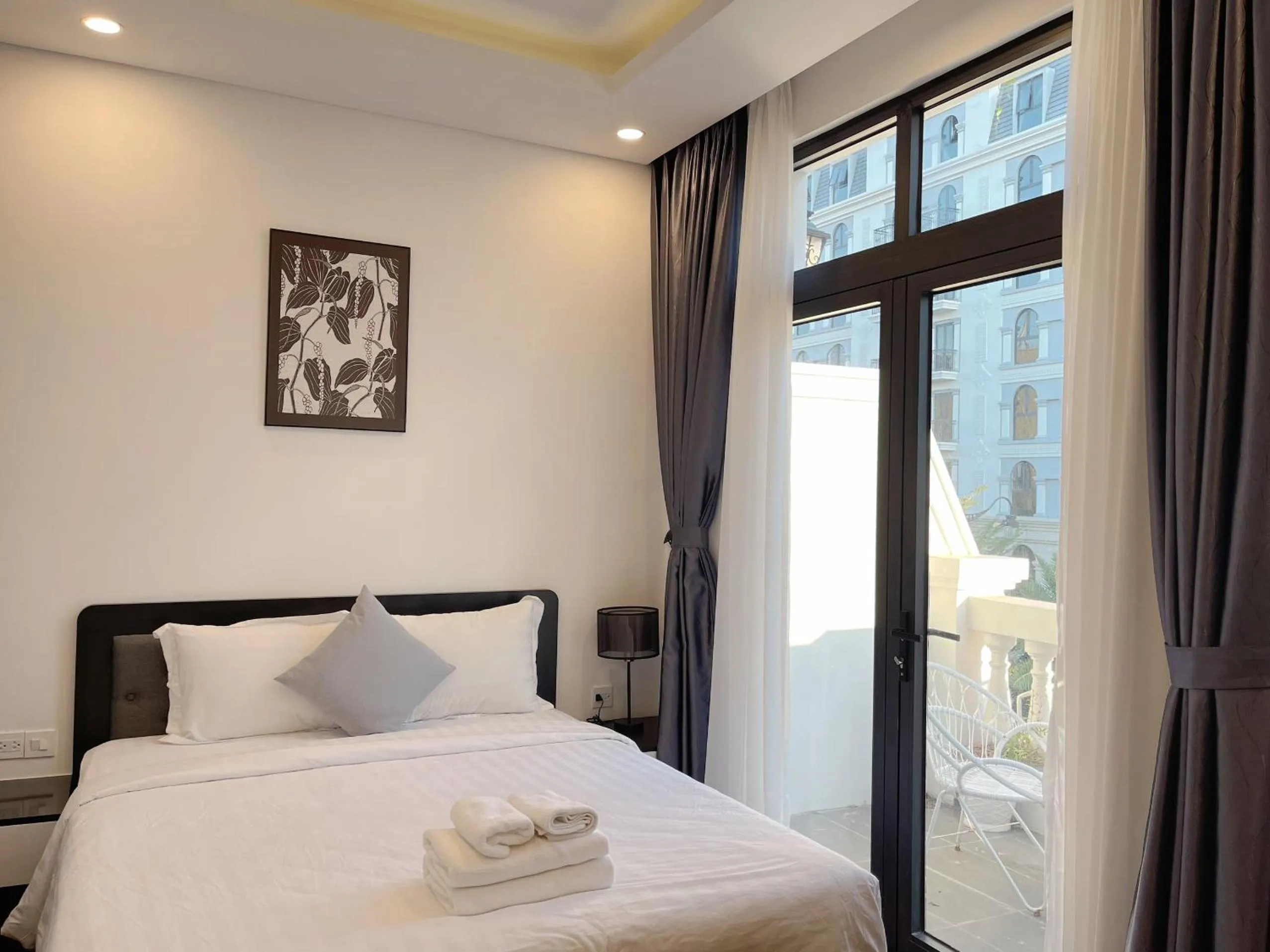 Bed in Le Palmier Phu Quoc Hotel - Free Shuttle To Grand World