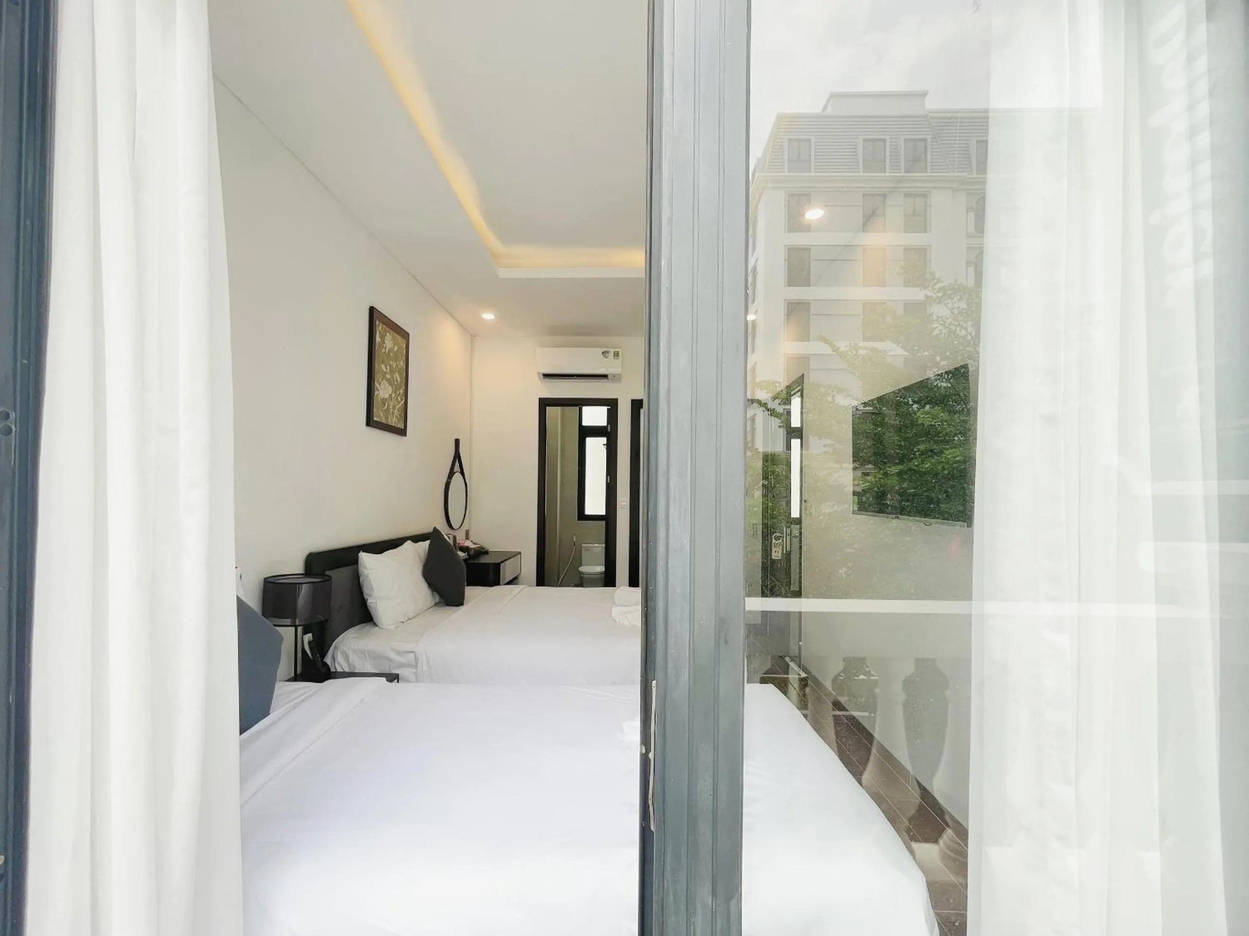 Photo of the whole room, Bed in Le Palmier Phu Quoc Hotel - Free Shuttle To Grand World