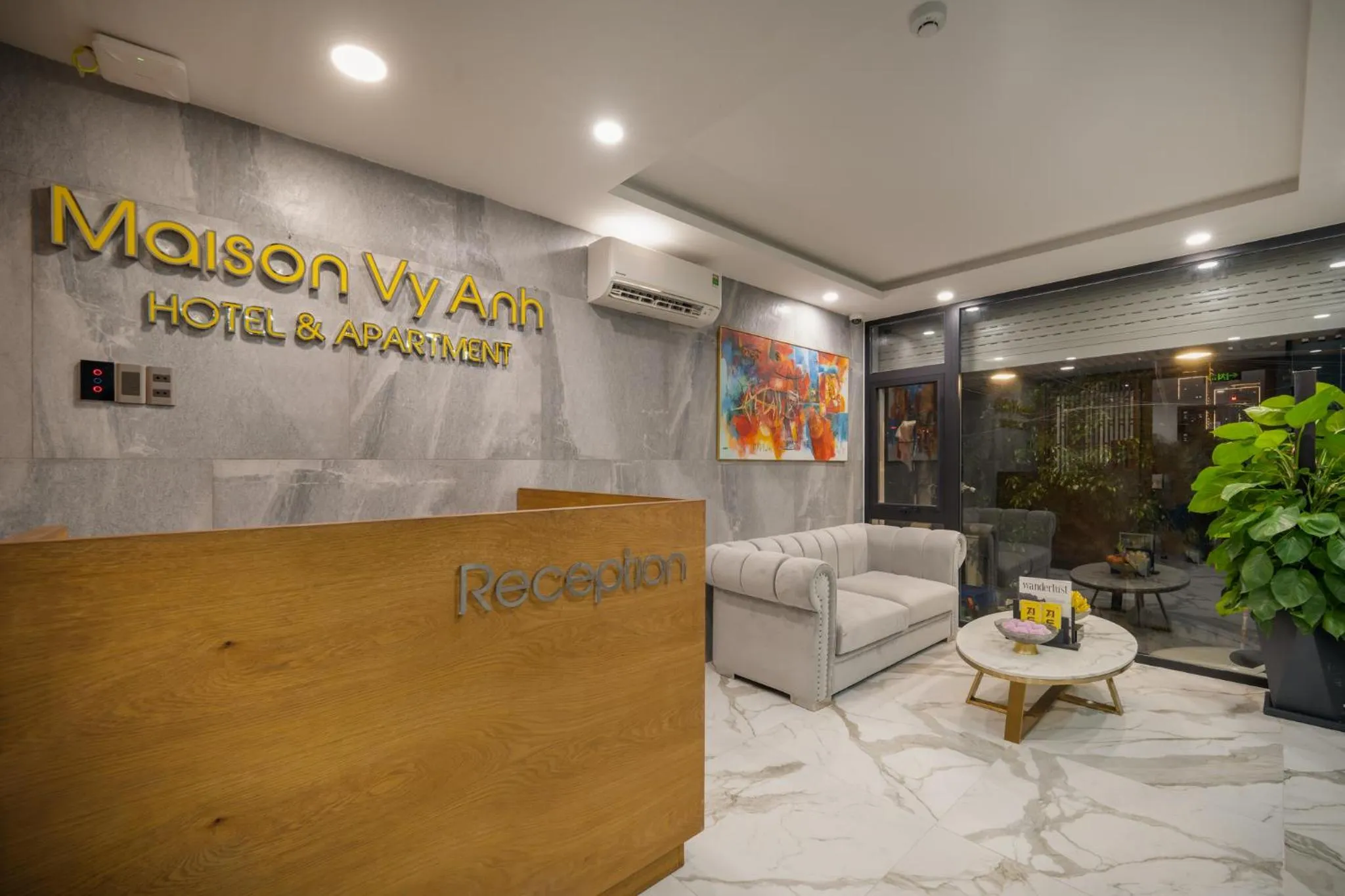 Property logo or sign in Maison Vy Anh Hotel & Apartment