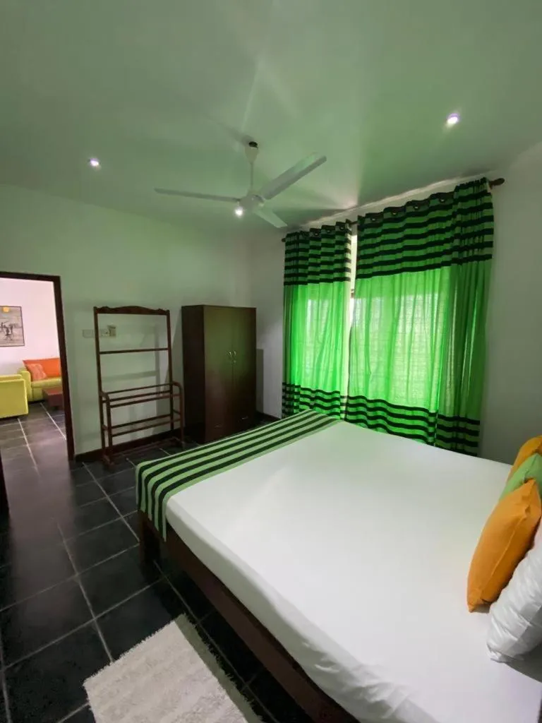 Bed in Reef Bungalow Hotel