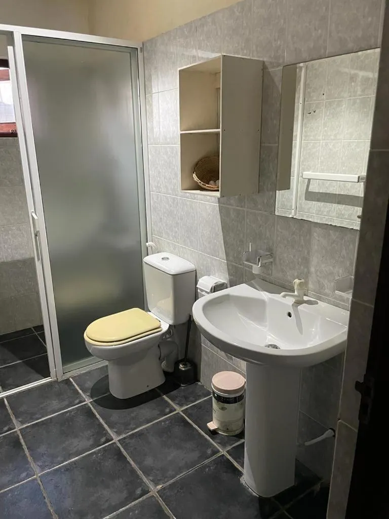 Toilet in Reef Bungalow Hotel