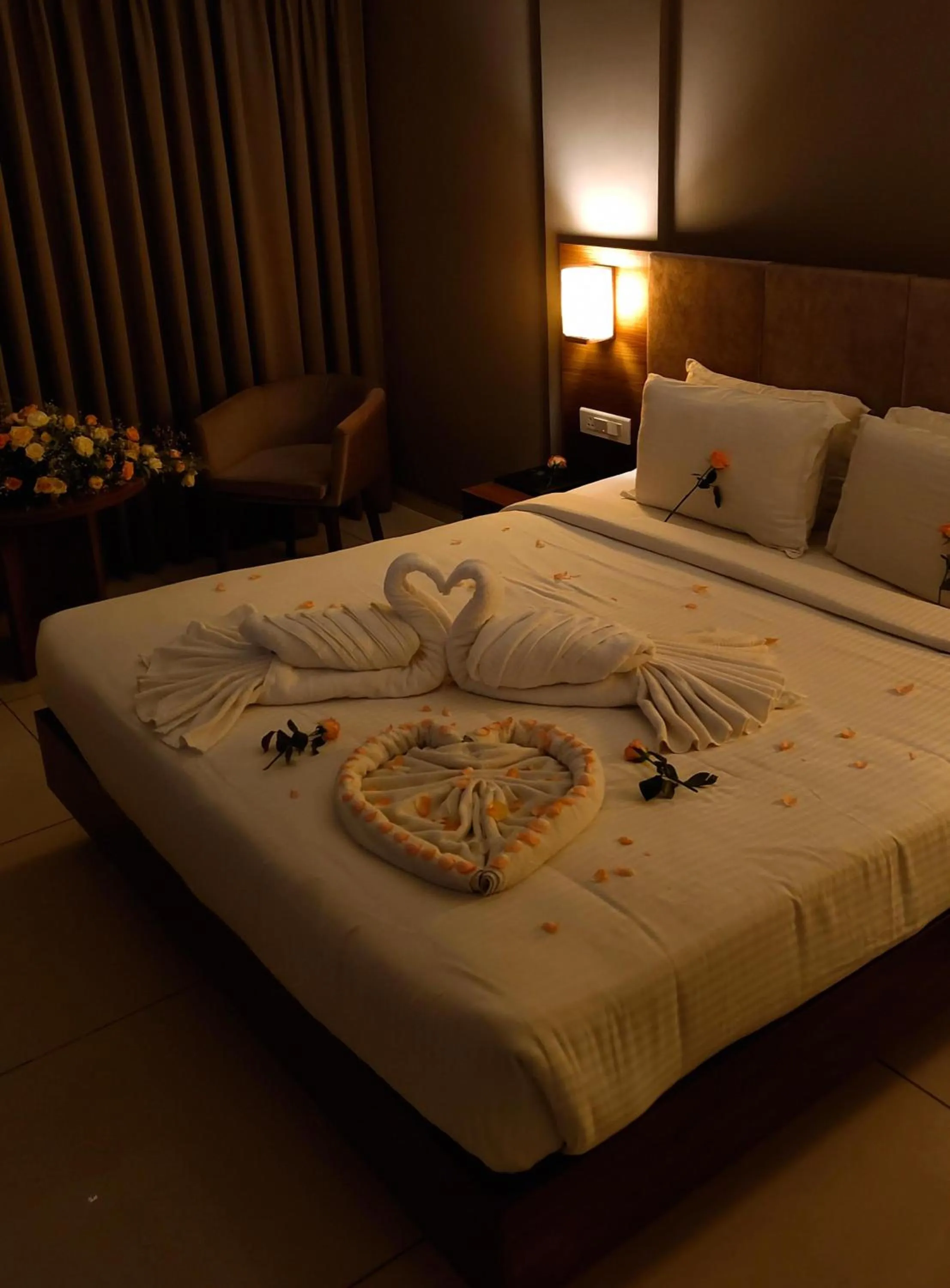 Bed in Hotel Kottayam Grand