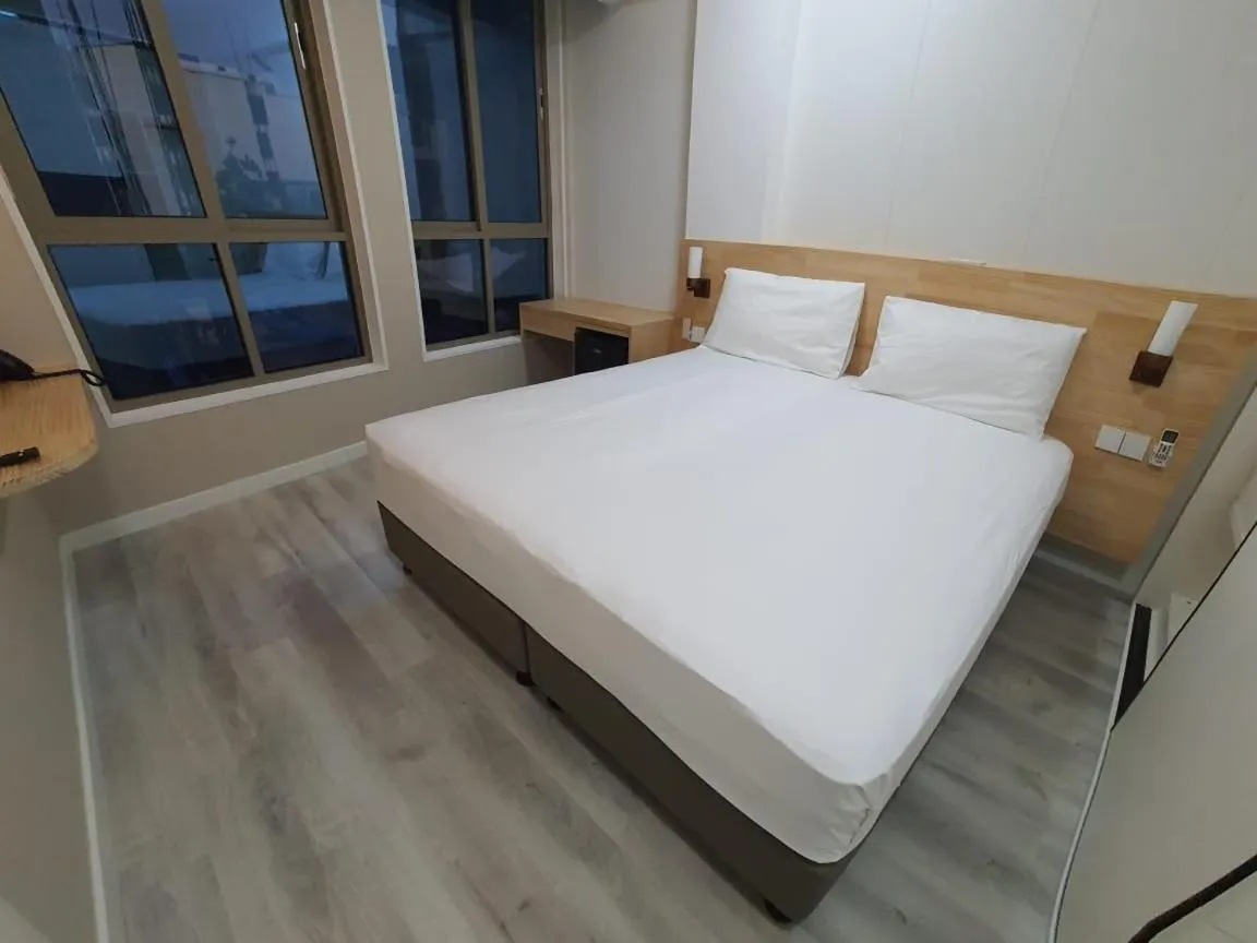 Bed in Tourist Inn Grand