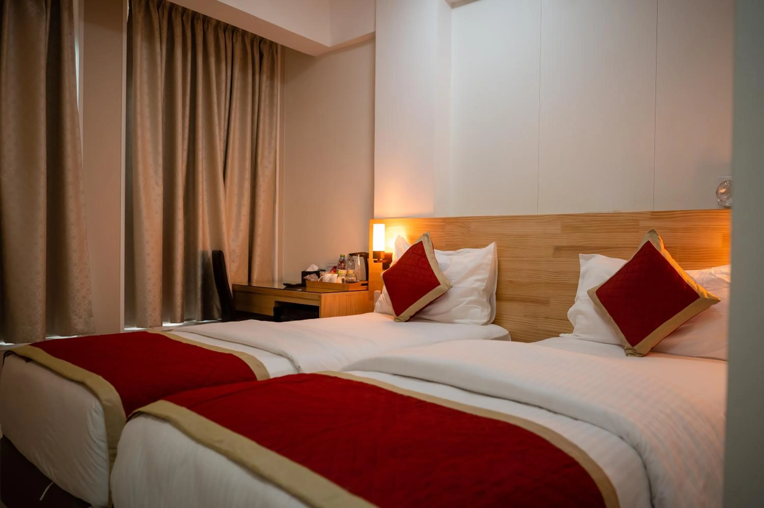 Bed in Tourist Inn Grand