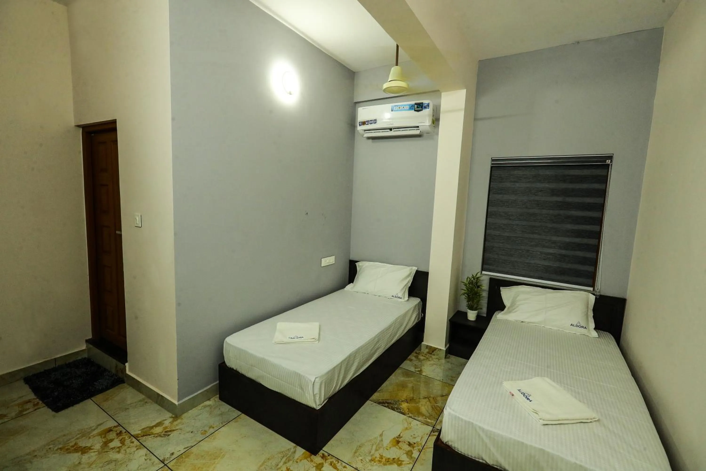 Bed in Aldora Airport Residency