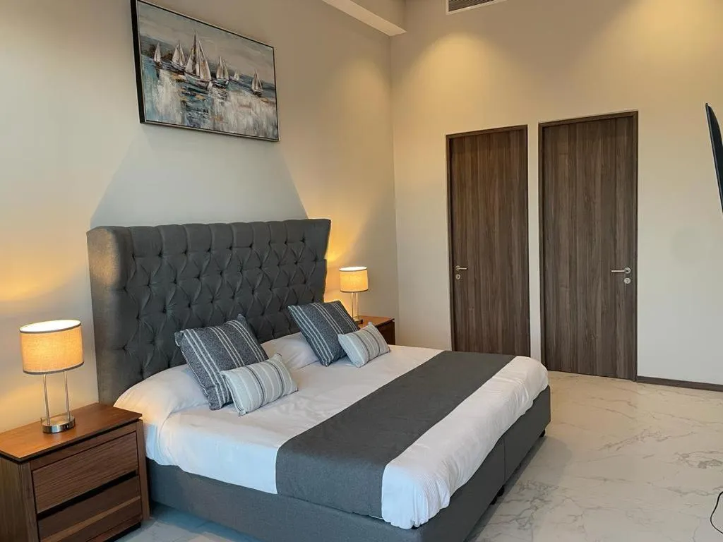 Bed in Maritima Front Beach Apartment