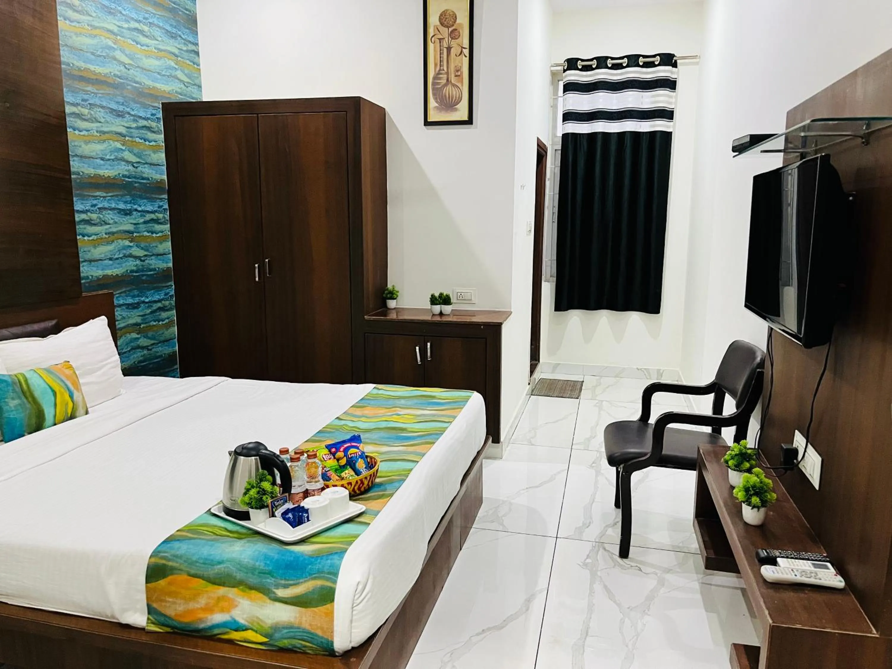 Photo of the whole room, Bed in Hotel Plaza Hyderabad Airport Zone