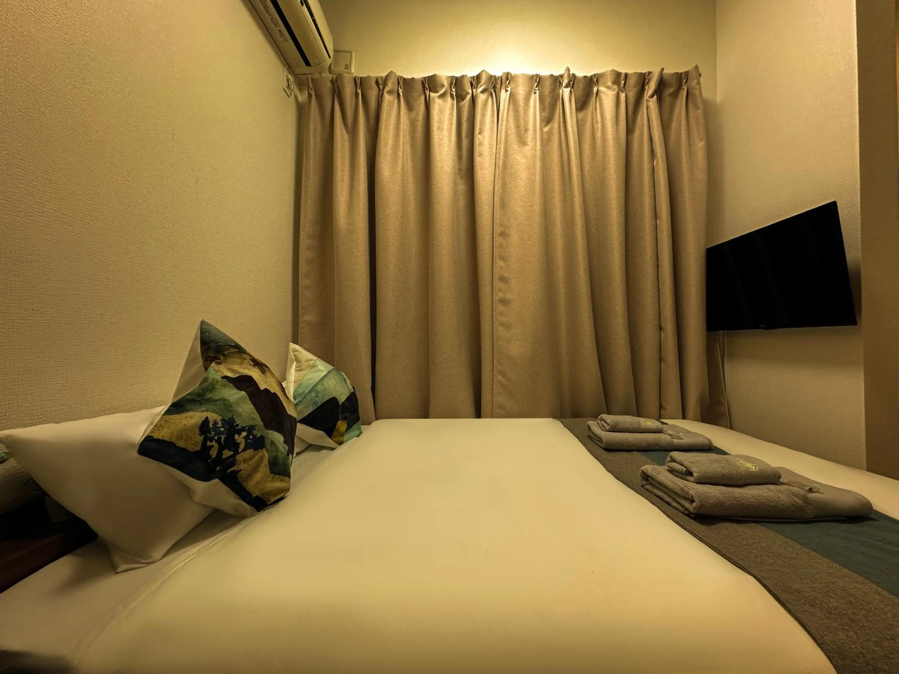 Bed in nestay suite tokyo ikebukuro