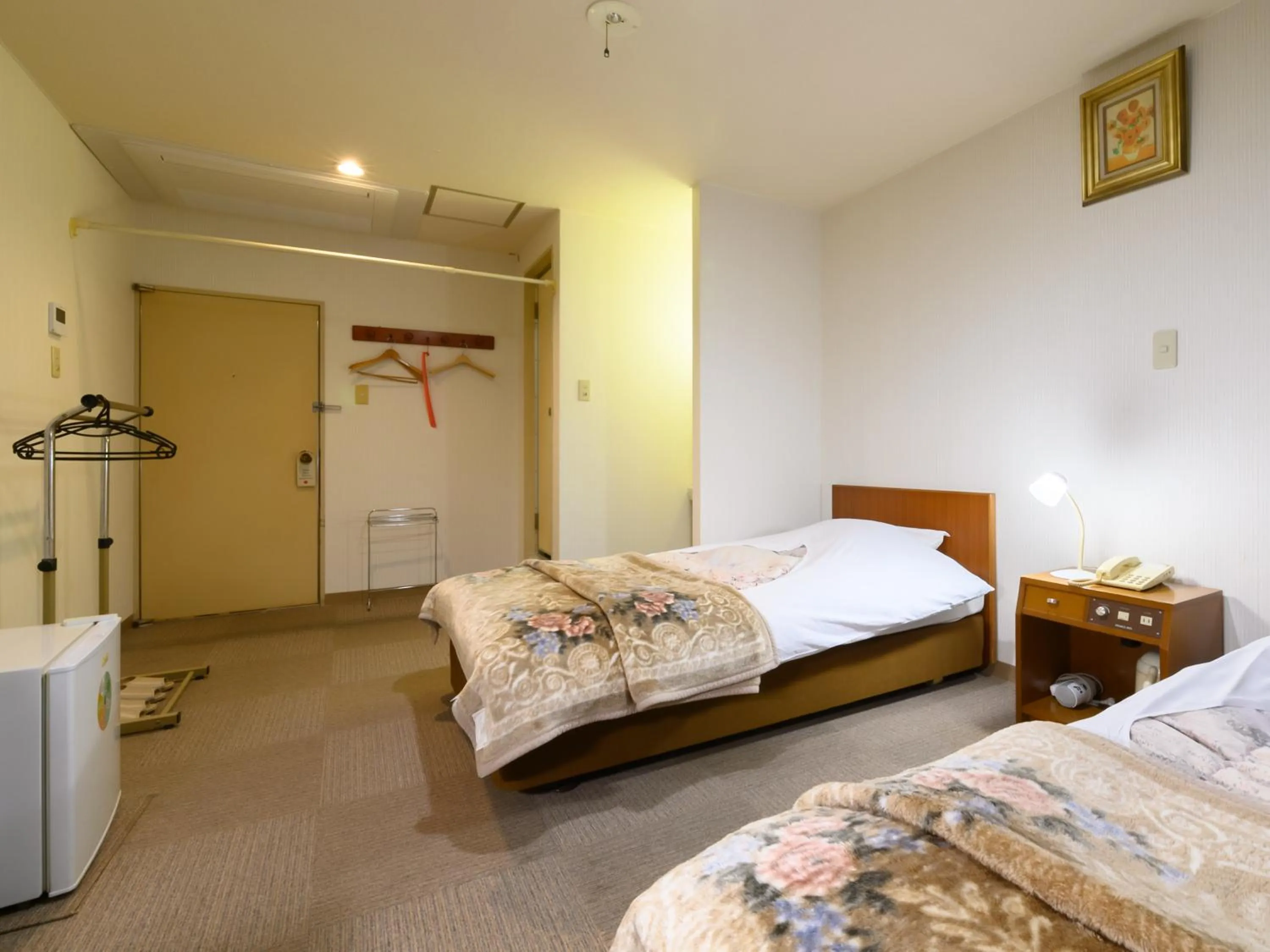 Bed in Tabist Business Ryokan Hotel Yukimiso