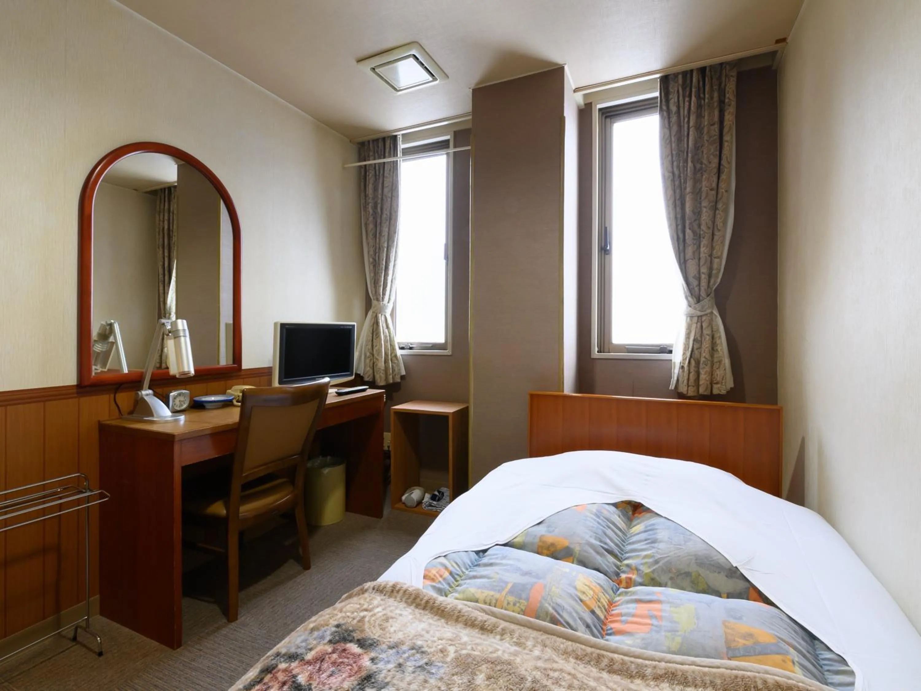 Bed in Tabist Business Ryokan Hotel Yukimiso