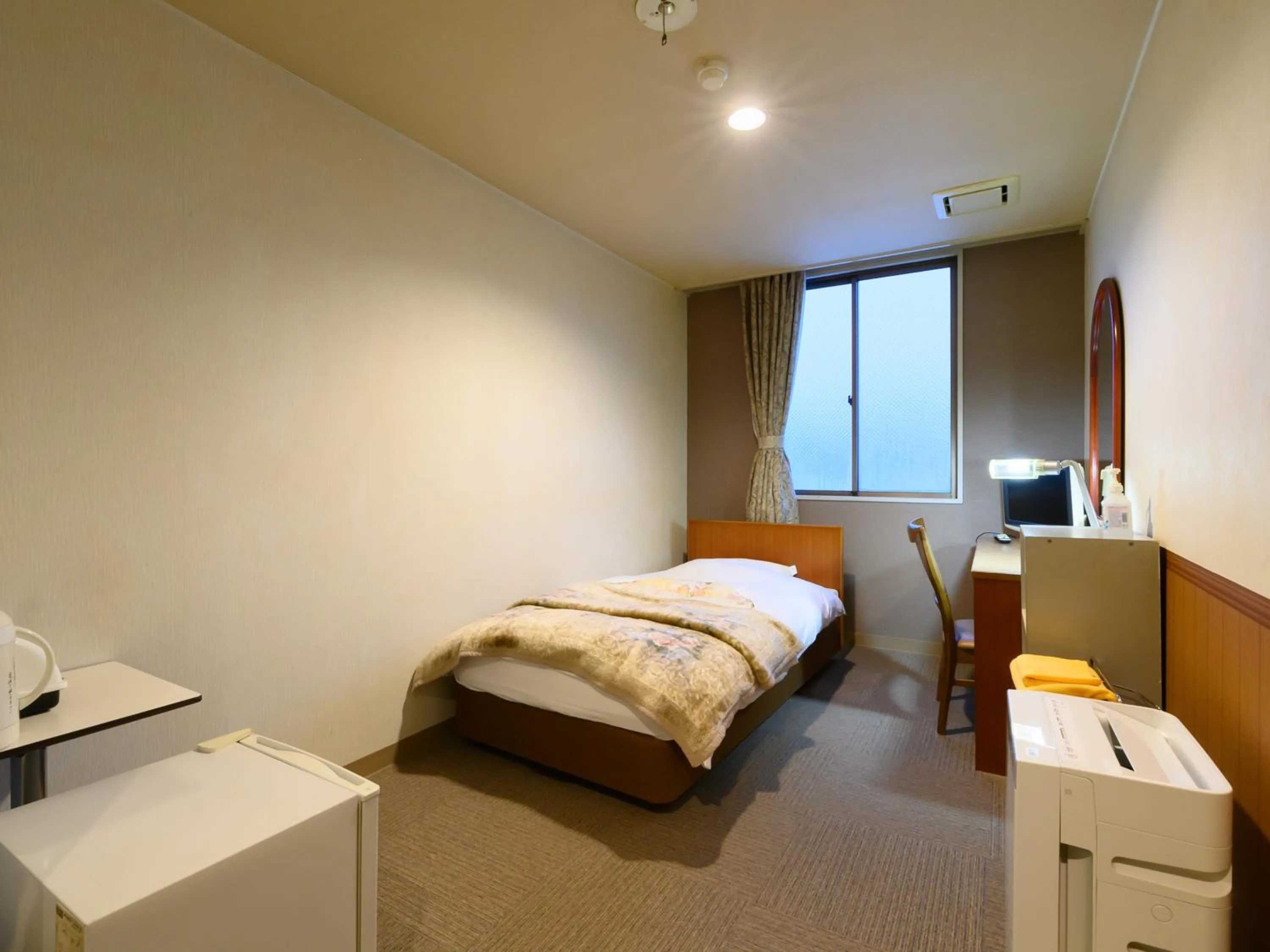 Bed in Tabist Business Ryokan Hotel Yukimiso