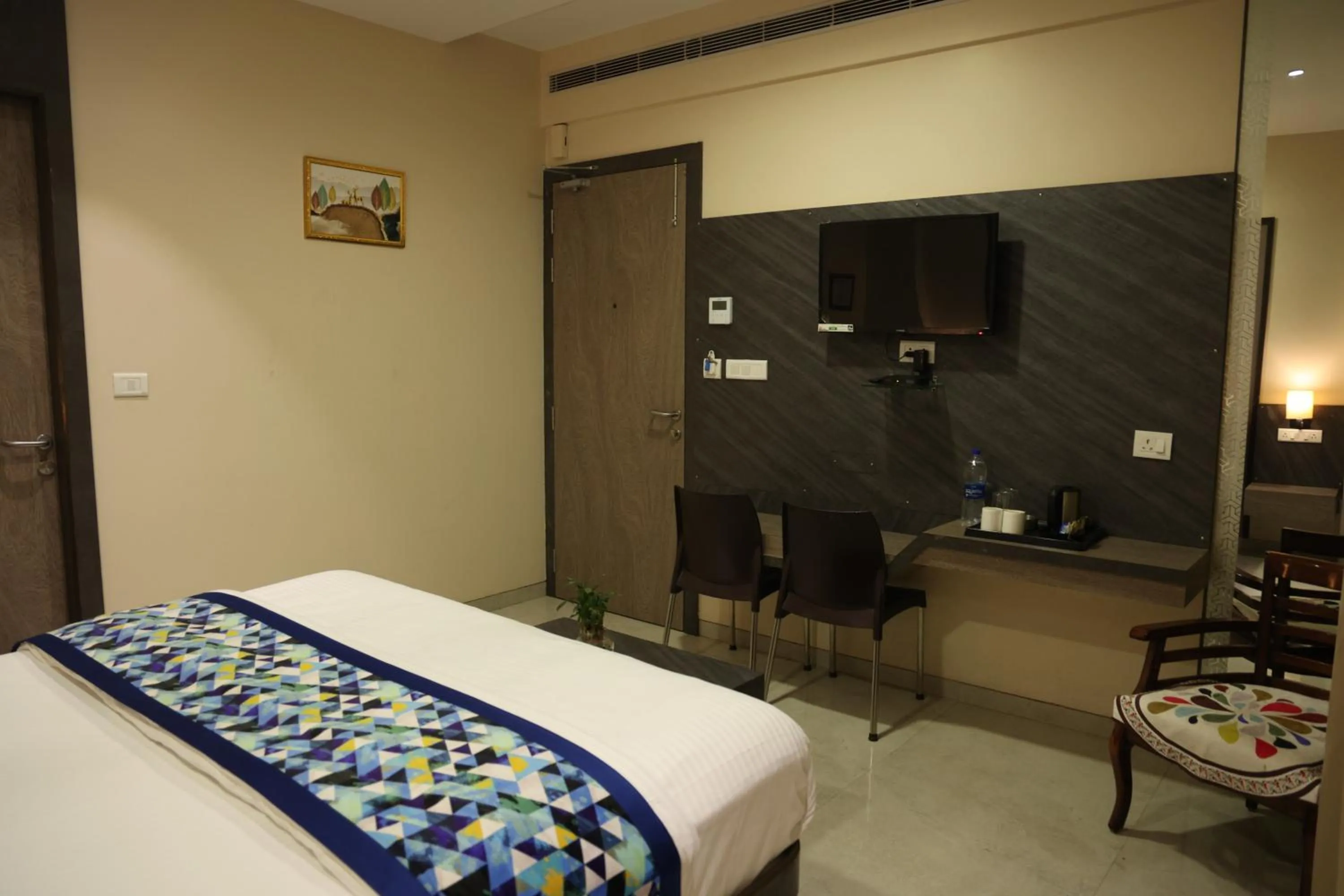 Bed in Hotel Pinaka Inn