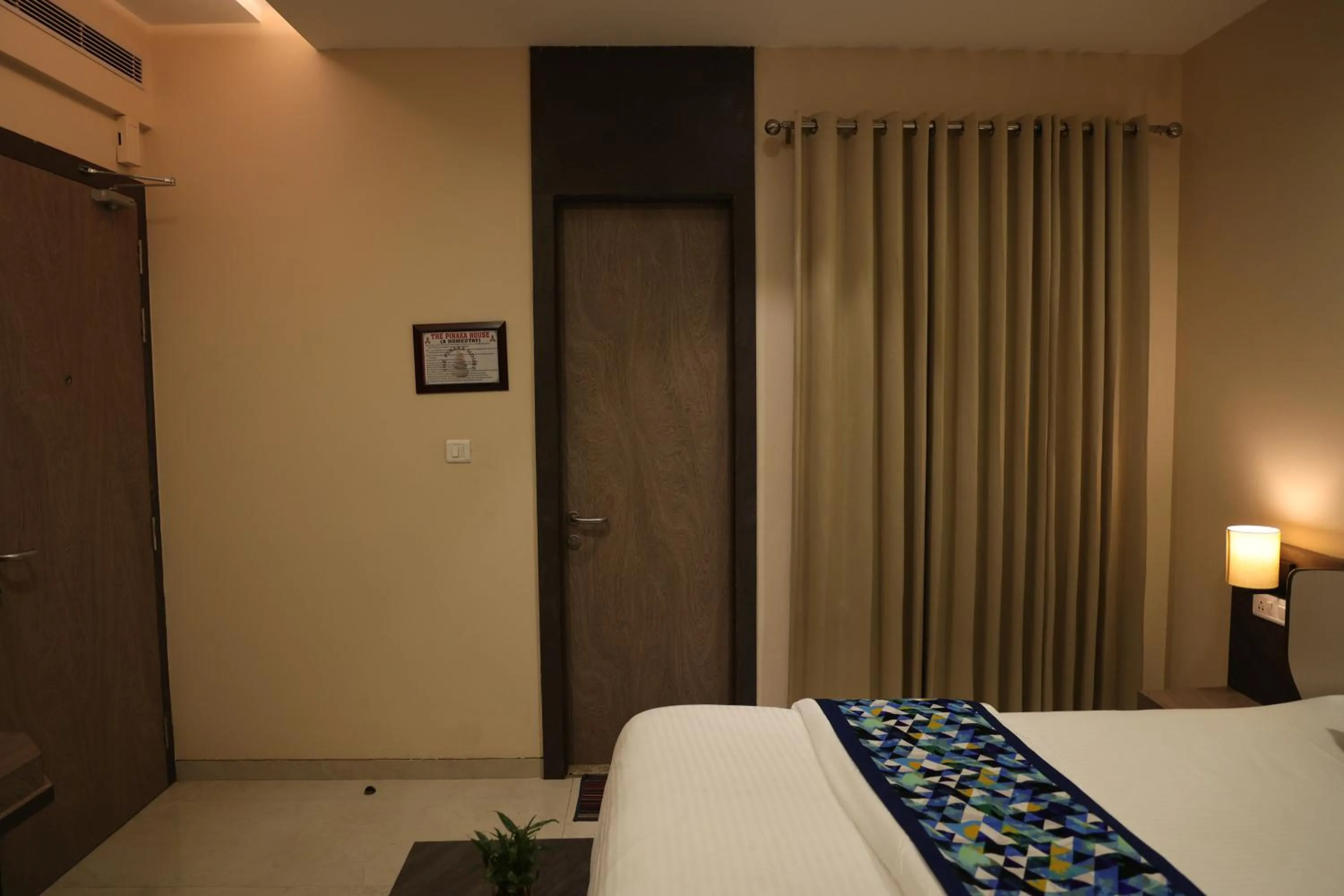 Bed in Hotel Pinaka Inn