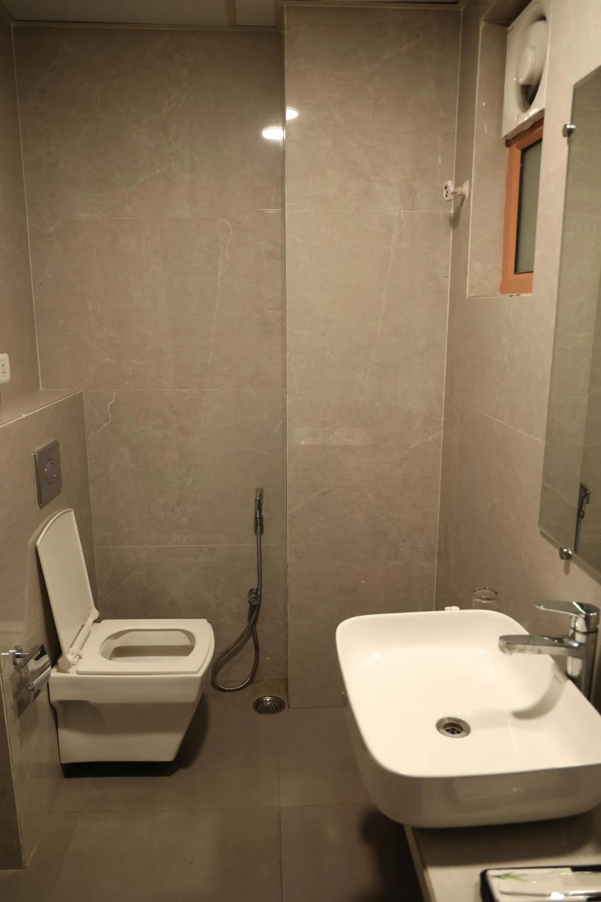 Toilet in Hotel Pinaka Inn